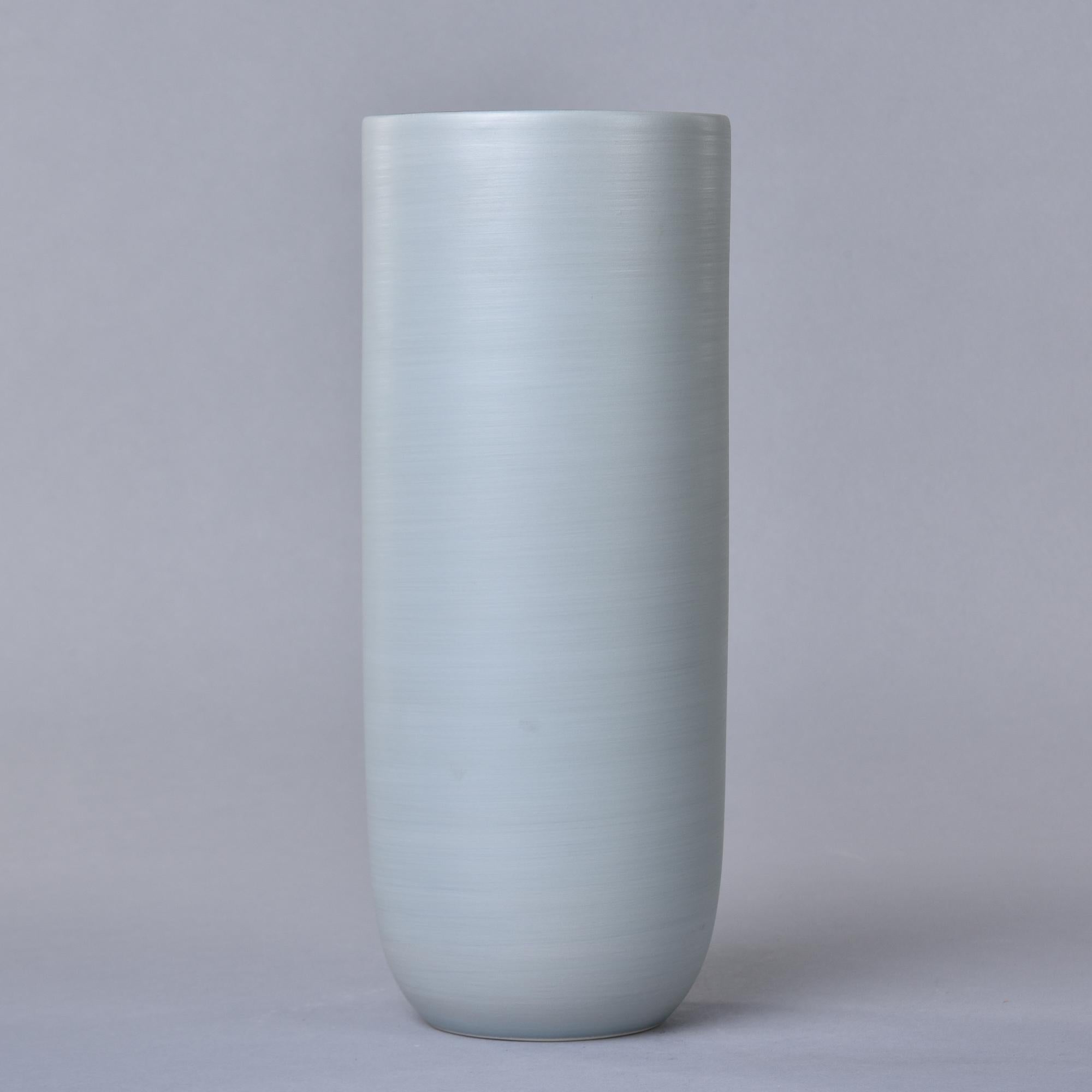 New and made in Italy by Rina Menardi, this tall Canna 1 vase stands over 12” tall. The vessel has a pale green tea colored glaze and a matte black interior glaze. Rina Menardi calls this shade of green bamboo. Signed on underside of base by the