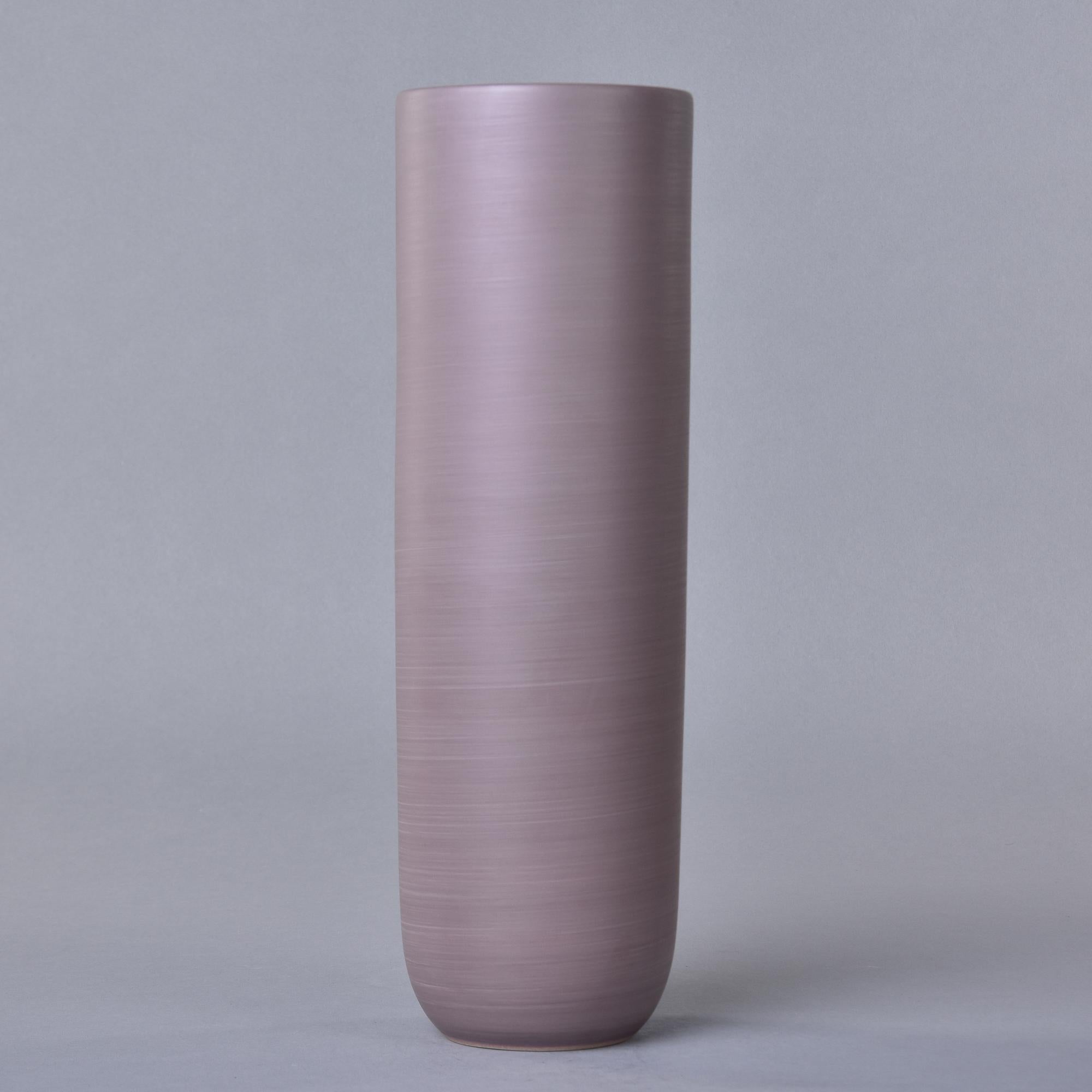 New and made in Italy by Rina Menardi, this ceramic vase is 14” tall. Exterior is glazed in a matte finish smoky lavender with a matte black interior. Signed by the maker on underside of base. At the time of this posting, we have several other Rina