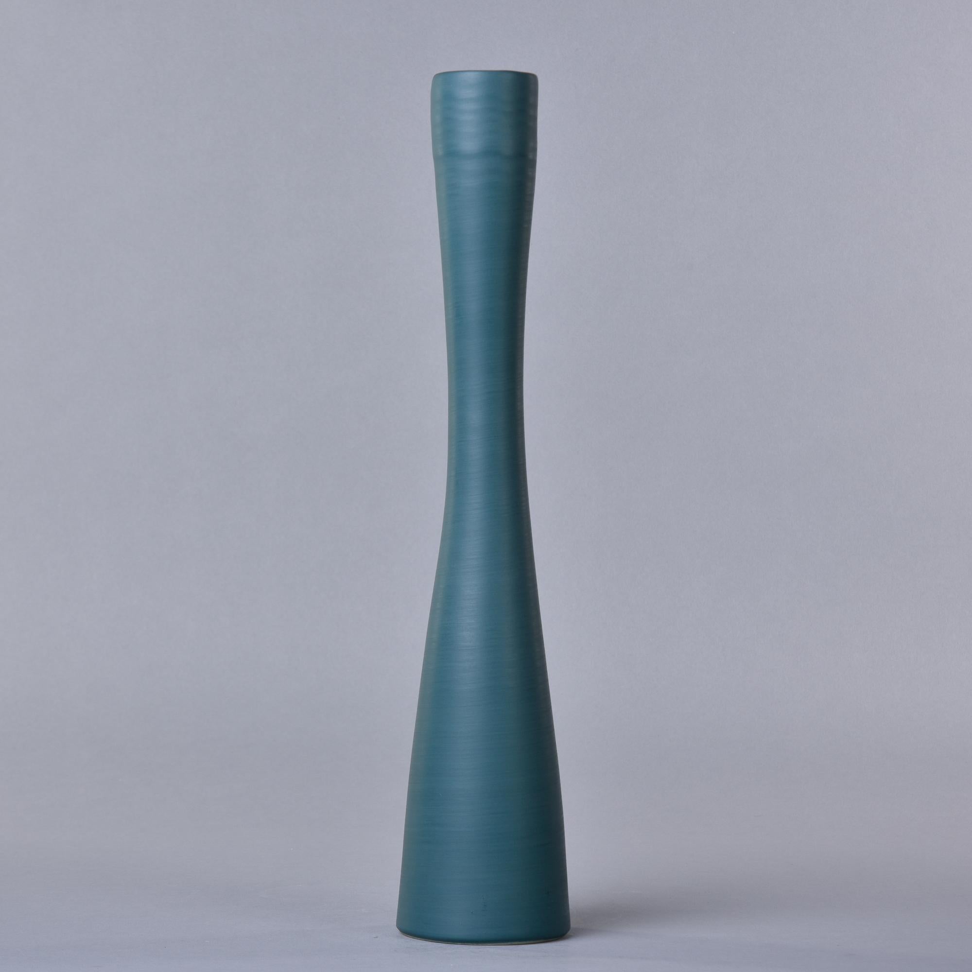 New and made in Italy by Rina Menardi, this tall slender vase is 18” high and has a saturated deep green colored glaze. Rina Menardi calls this shade of green Mint. The inside of the vase has a contrasting soft black wash glaze. Other colors and