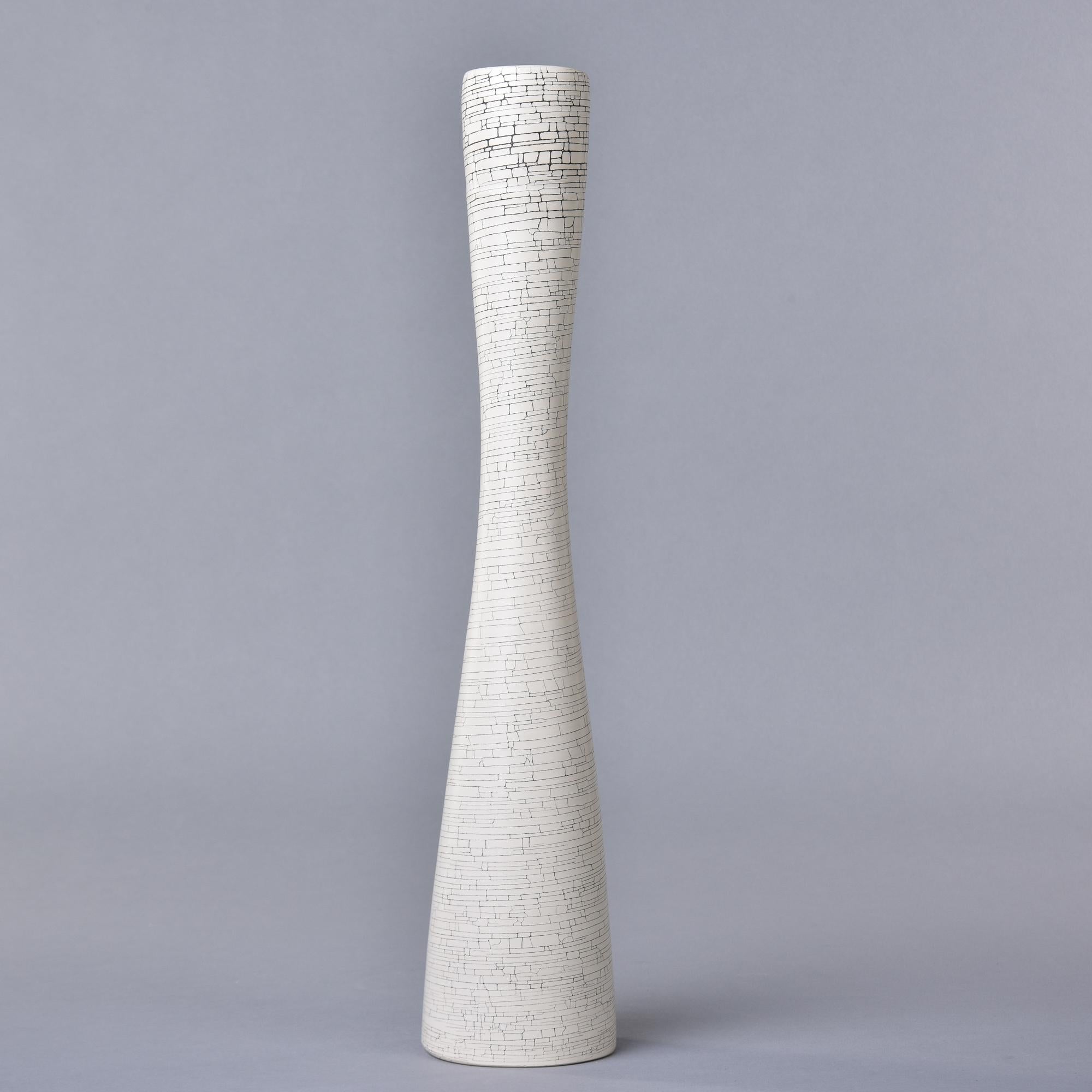 New and made in Italy by Rina Menardi, this tall slender vase is 18” high and has a white crackled glaze. Inside has a contrasting soft black wash. Other colors and shape from this maker available.