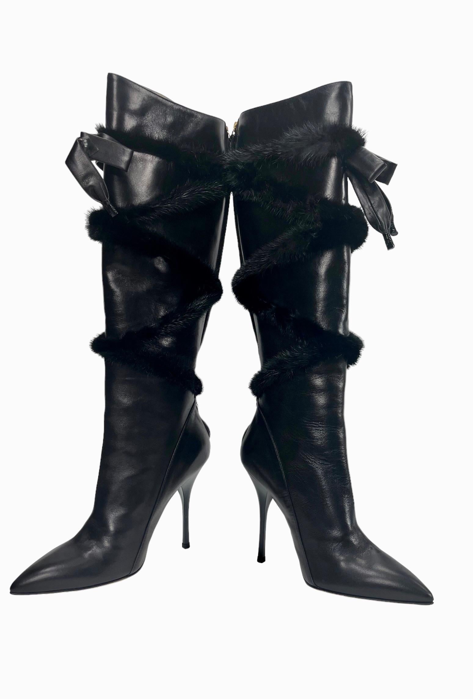 New Roberto Cavalli Black Leather Knee High Boots with Mink  
Italian 37 - US 7 
100% Leather upper, Genuine mink fur, Leather bow. Lining: Smooth 100% leather in gold. Gold Leather sole. Back zip for easy on/off.
Heel height: 4.5 inches, Height of