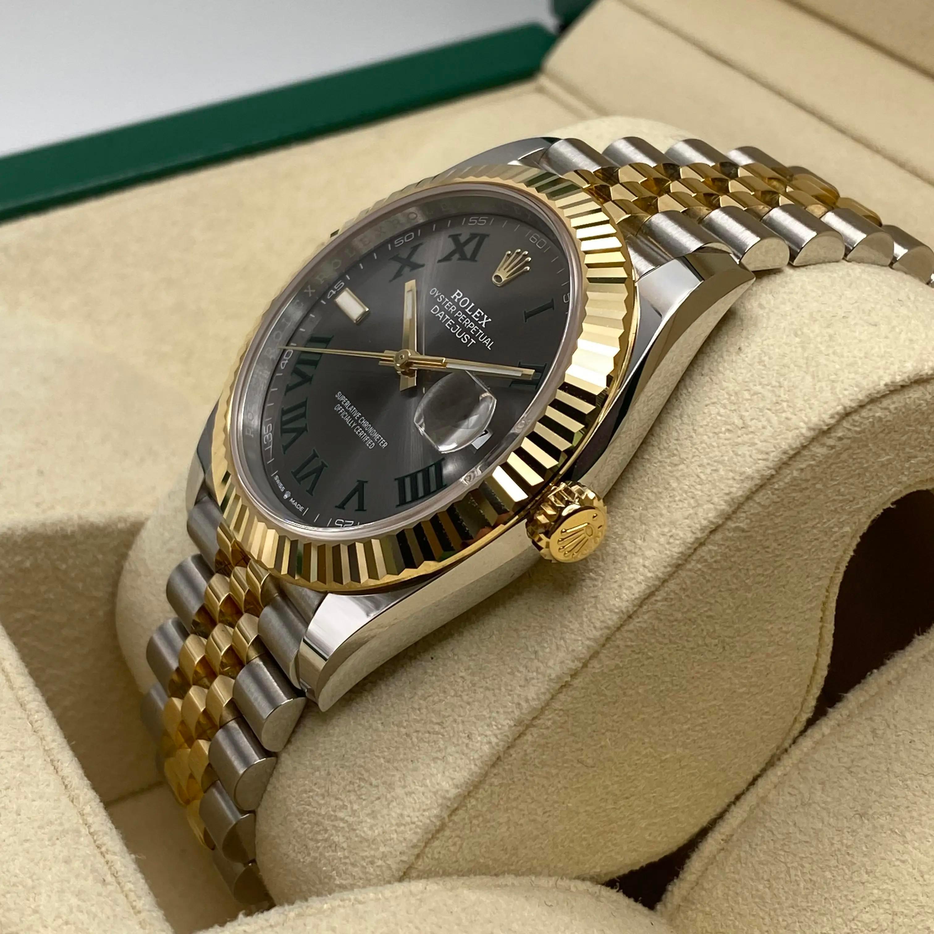 Unworn. Comes with original box and papers.