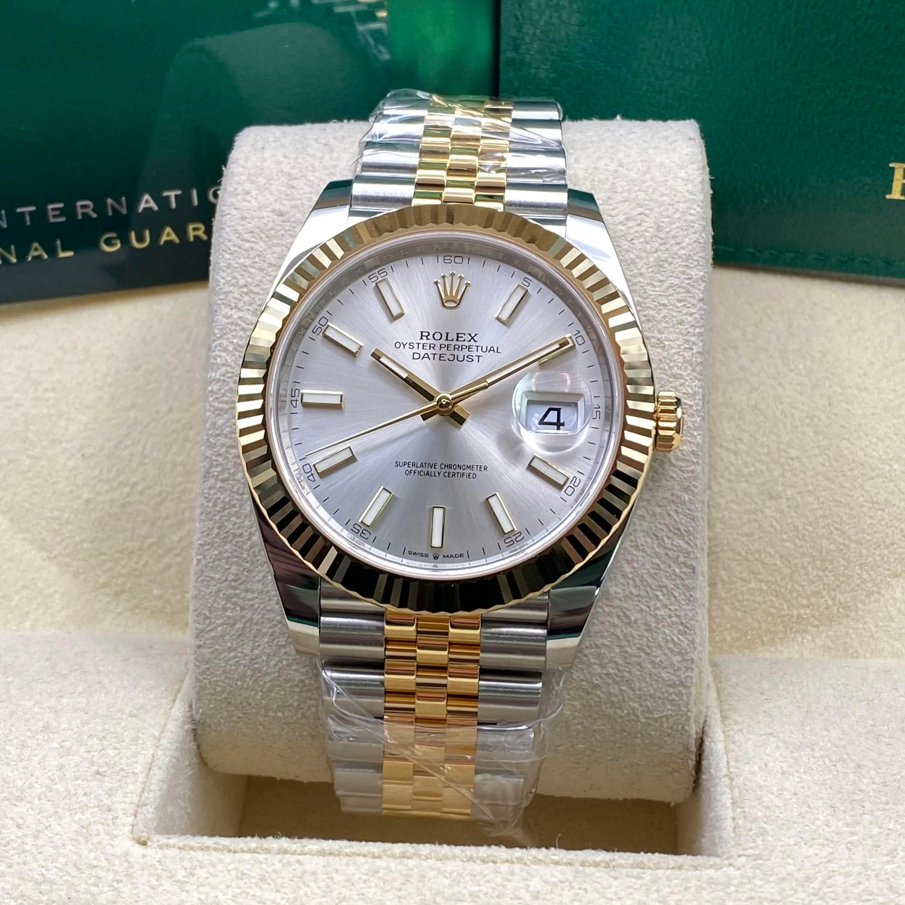 Unworn. Comes with an original box and papers.