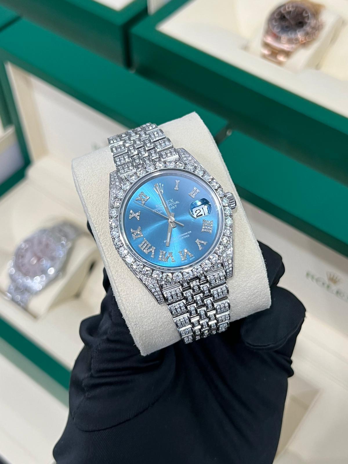 A Beautifully Customized Pave Diamond Dial Datejust 41mm Watch with Roman Numerals!!! This Watch Has Been Set Wonderfully and Is Fully Iced Out! the Diamonds Are Top Quality and the Watch Comes with Box and Papers.
Model number: 126300
Movement: