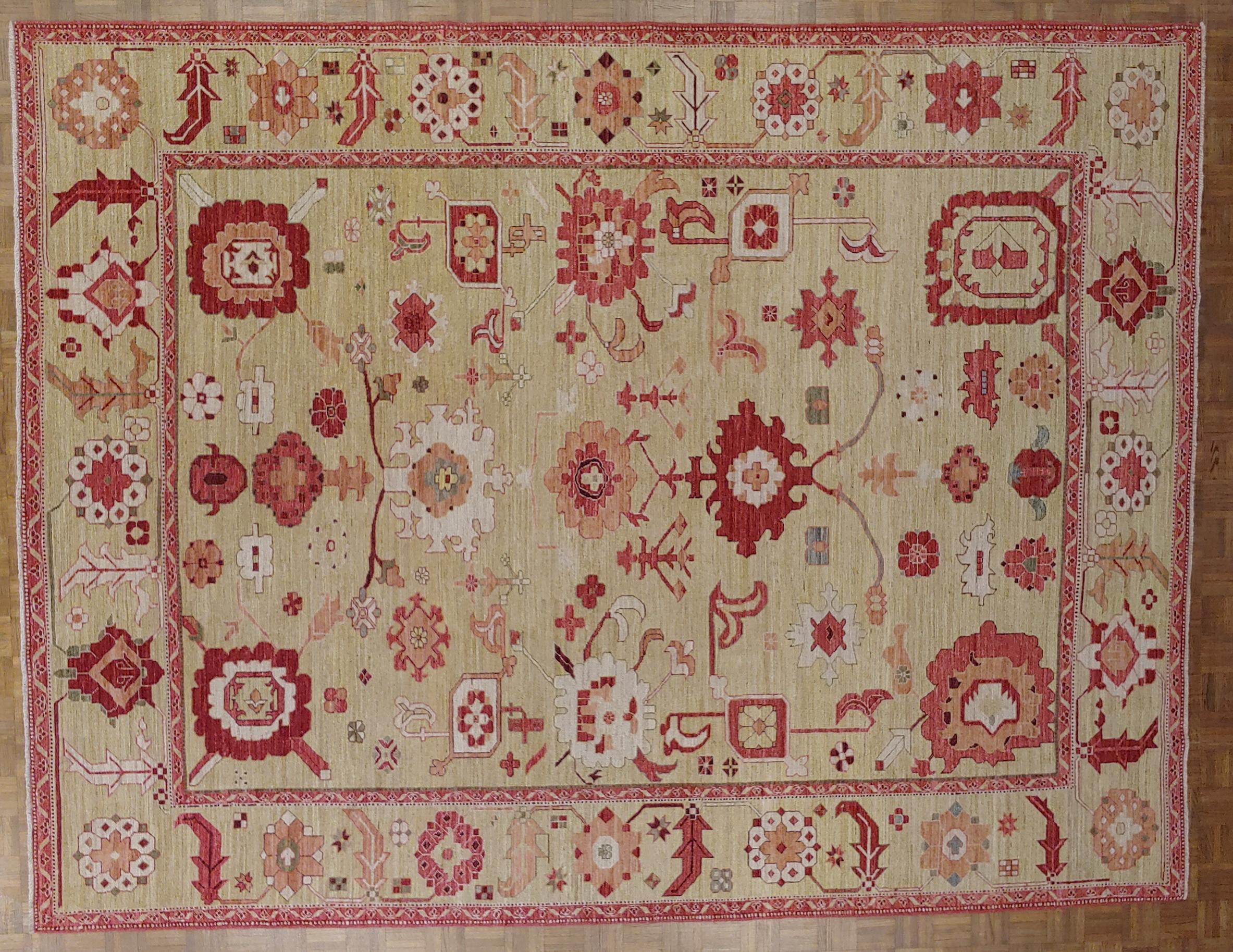 This is one our very best rugs. Hand woven in Afghanistan, these rugs offer a superior hand-spun wool and a striking medley of wonderful, all natural dyes. This rug is reminiscent of an early Sultanabad motif with classic Turkish Oushak colors of