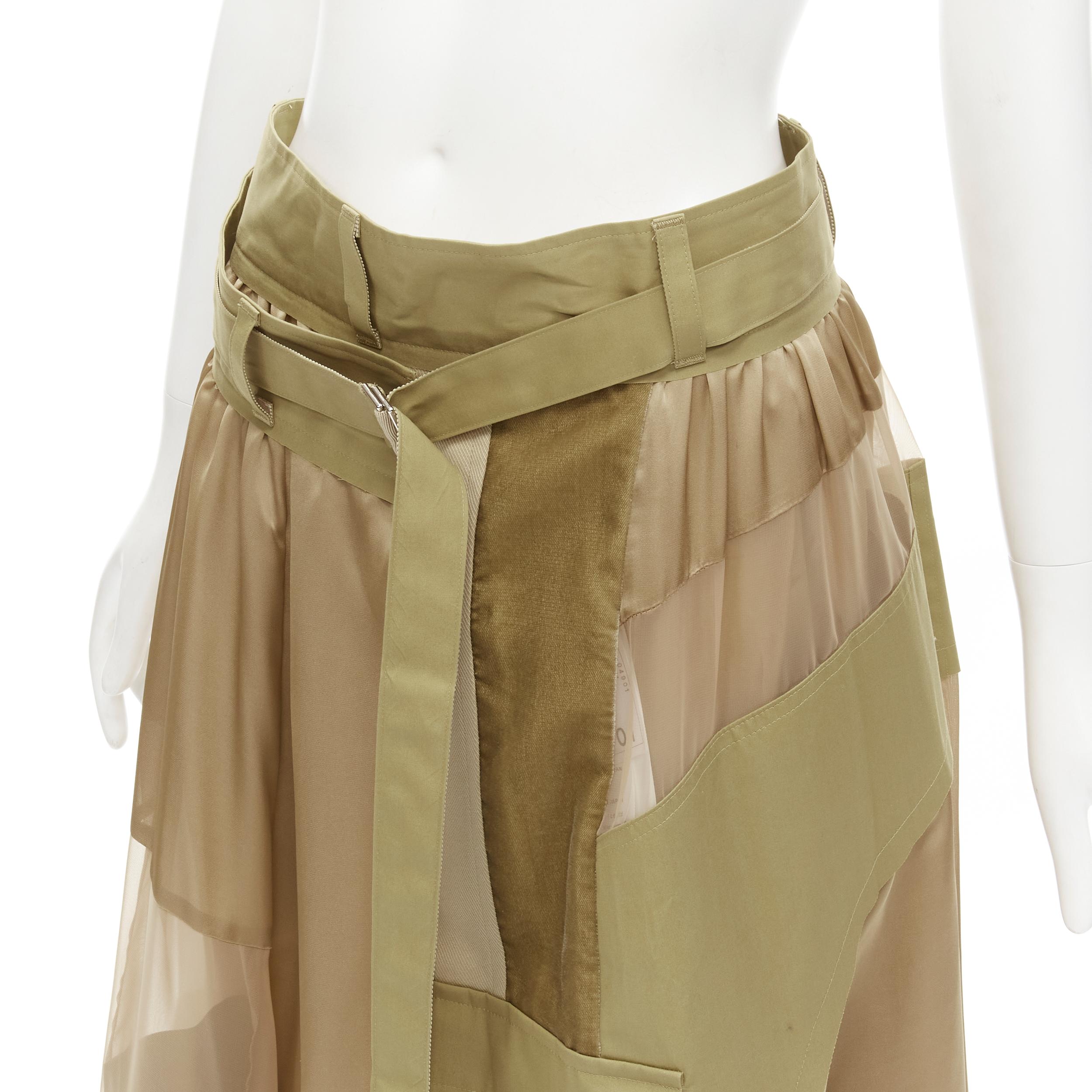 new SACAI 2020 khaki military patchwork sheer deconstructed belted skirt JP3 L
Brand: Sacai
Designer: Chitose Abe
Collection: 2020 
Material: Mixed Materials
Color: Brown
Pattern: Solid
Closure: Belt
Extra Detail: Beige cotton and viscose mixed