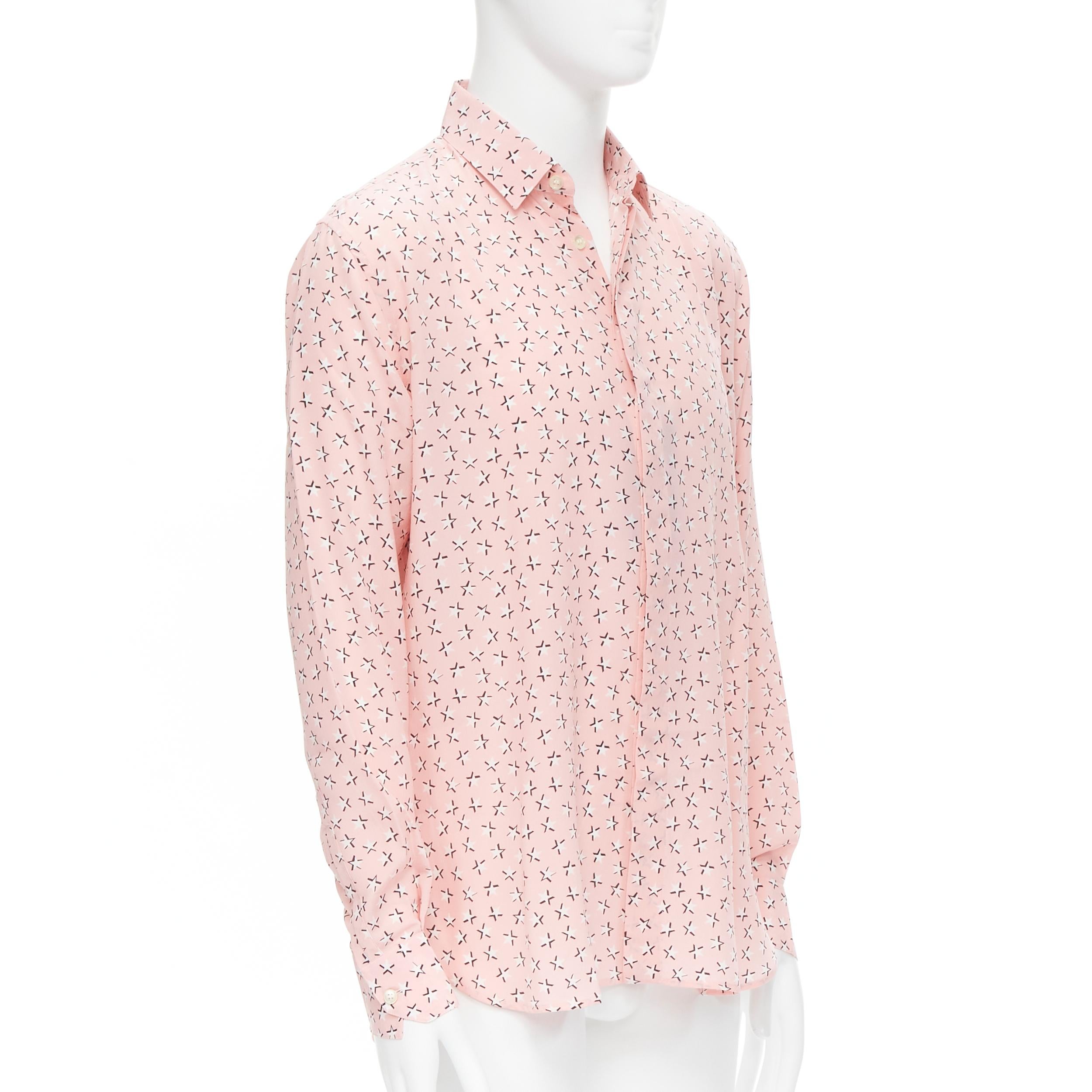 new Saint Laurent 2018 100% silk pink white star print long sleeve shirt S EU38 
Reference: TGAS/B01774 
Brand: Saint Laurent 
Collection: 2018 
Material: Silk 
Color: Pink 
Pattern: Star 
Closure: Button 
Extra Detail: Concealed button front.