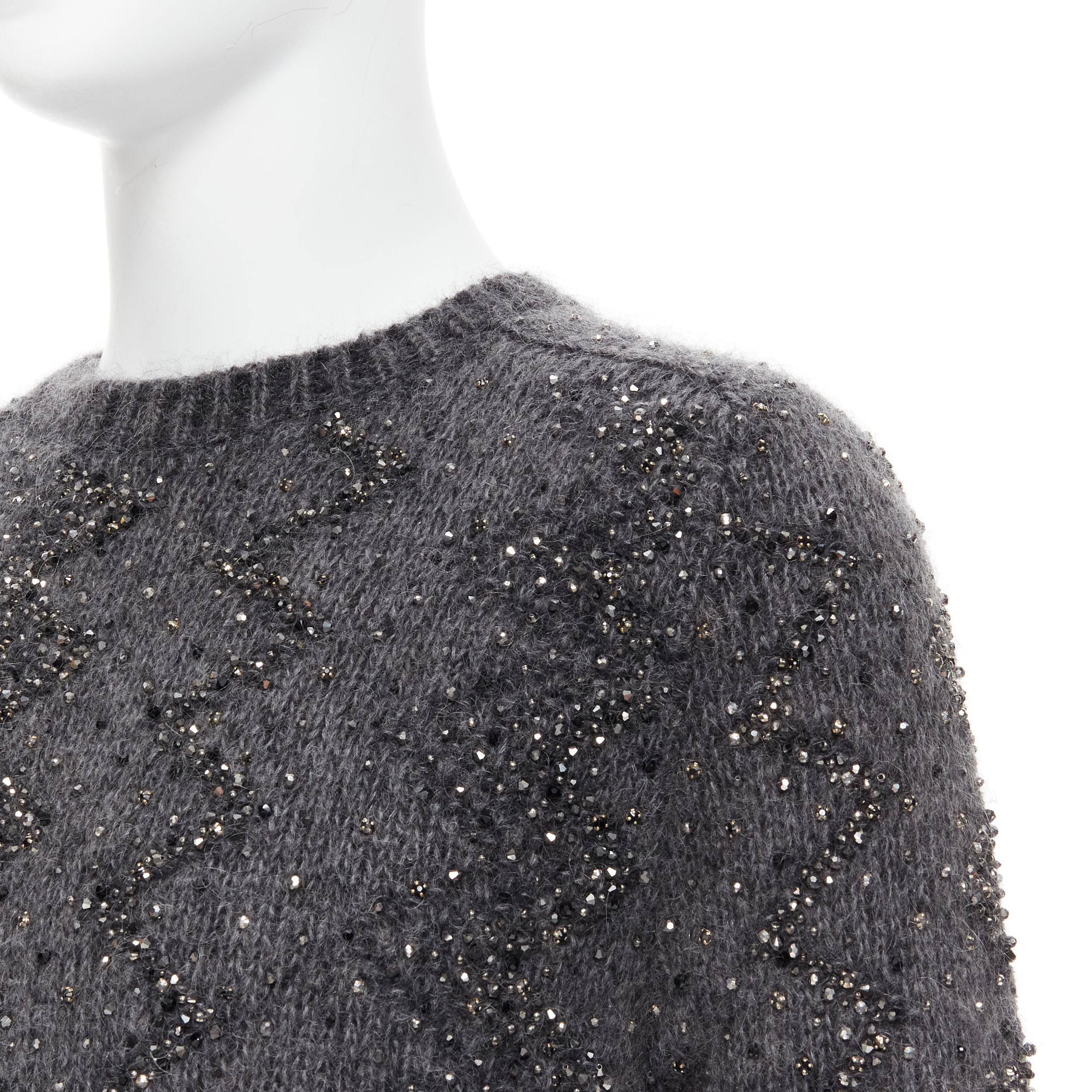 new SAINT LAURENT 2018 mohair wool crystal rhinestone embellished sweater M 
Reference: TGAS/B01701 
Brand: Saint Laurent 
Designer: Anthony Vaccarello 
Material: Wool 
Color: Grey 
Pattern: Solid 
Extra Detail: Mohair wool blend sweater. Silver and