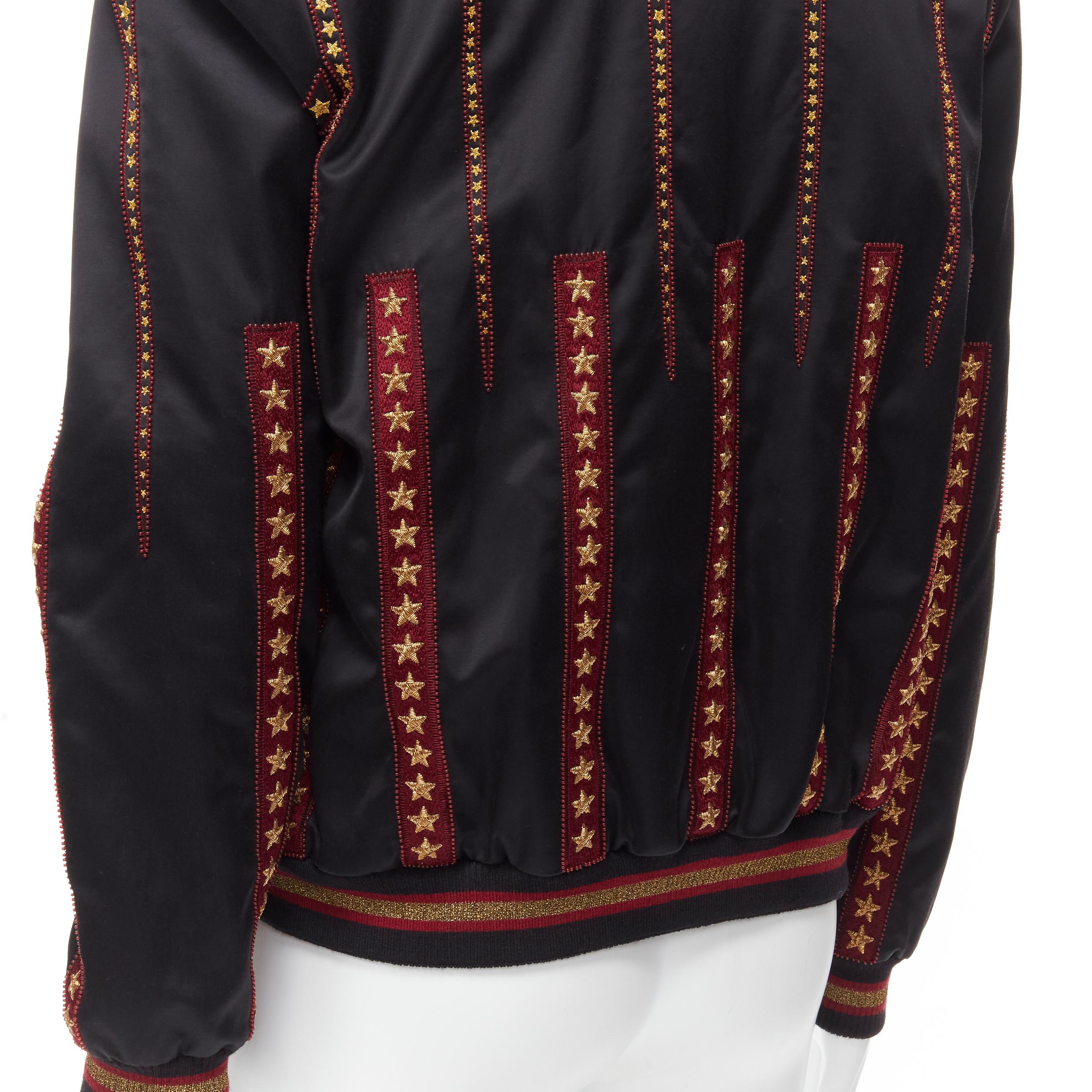 new SAINT LAURENT 2018 Teddy black gold star red bead embellished bomber EU50 L 
Reference: TGAS/B01703 
Brand: Saint Laurent 
Designer: Anthony Vaccarello 
Collection: 2018 Runway 
Material: Satin 
Color: Black 
Pattern: Solid 
Closure: Button