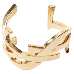 SAINT LAURENT Cassandre - Bracelet manchette en métal doré et laiton avec logo monogramme YSL, neuve