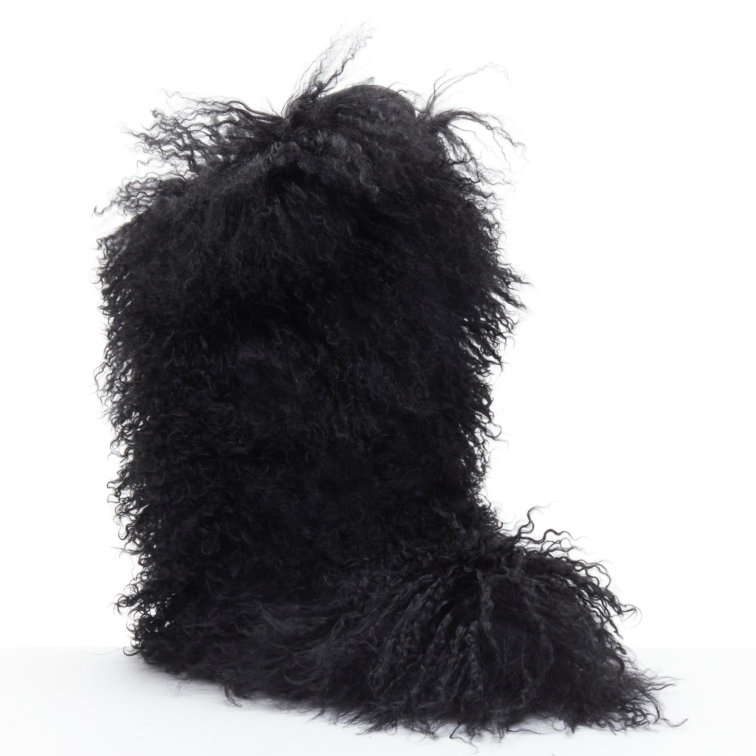 new SAINT LAURENT Furry Patch black curly Mongolian fur pull on snow boot EU37 
Reference: TGAS/B01727 
Brand: Saint Laurent 
Designer: Anthony Vaccarello 
Material: Fur 
Color: Black 
Pattern: Solid 
Extra Detail: Curly Mongolian fur upper. Leather