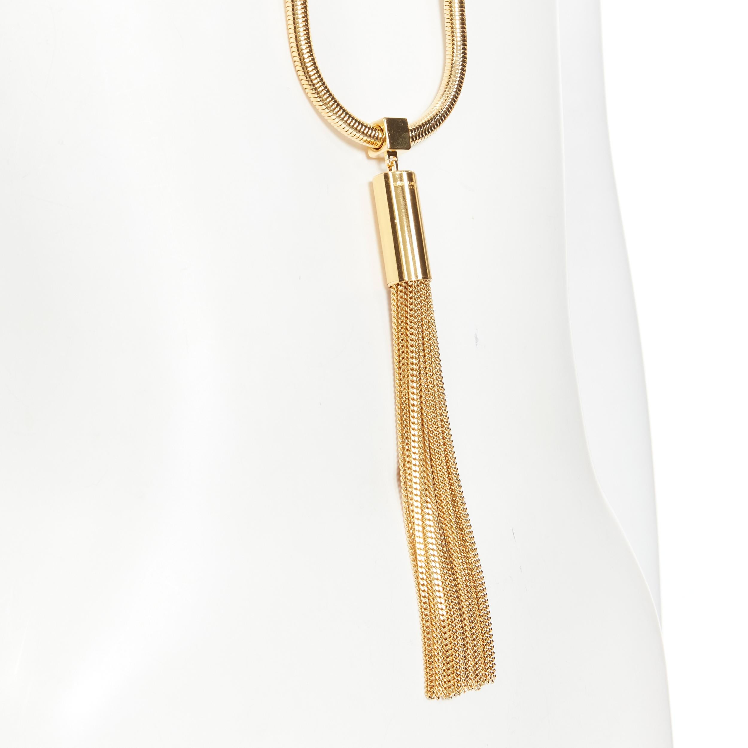 new SAINT LAURENT Hedi Slimane 2013 Runway Opium Deco gold tassel necklace 
Reference: TGAS/B01734 
Brand: Saint Laurent 
Designer: Hedi Slimane 
Collection: 2013 Runway 
As seen on: Rihanna 
Material: Metal 
Color: Gold 
Pattern: Solid 
Closure: