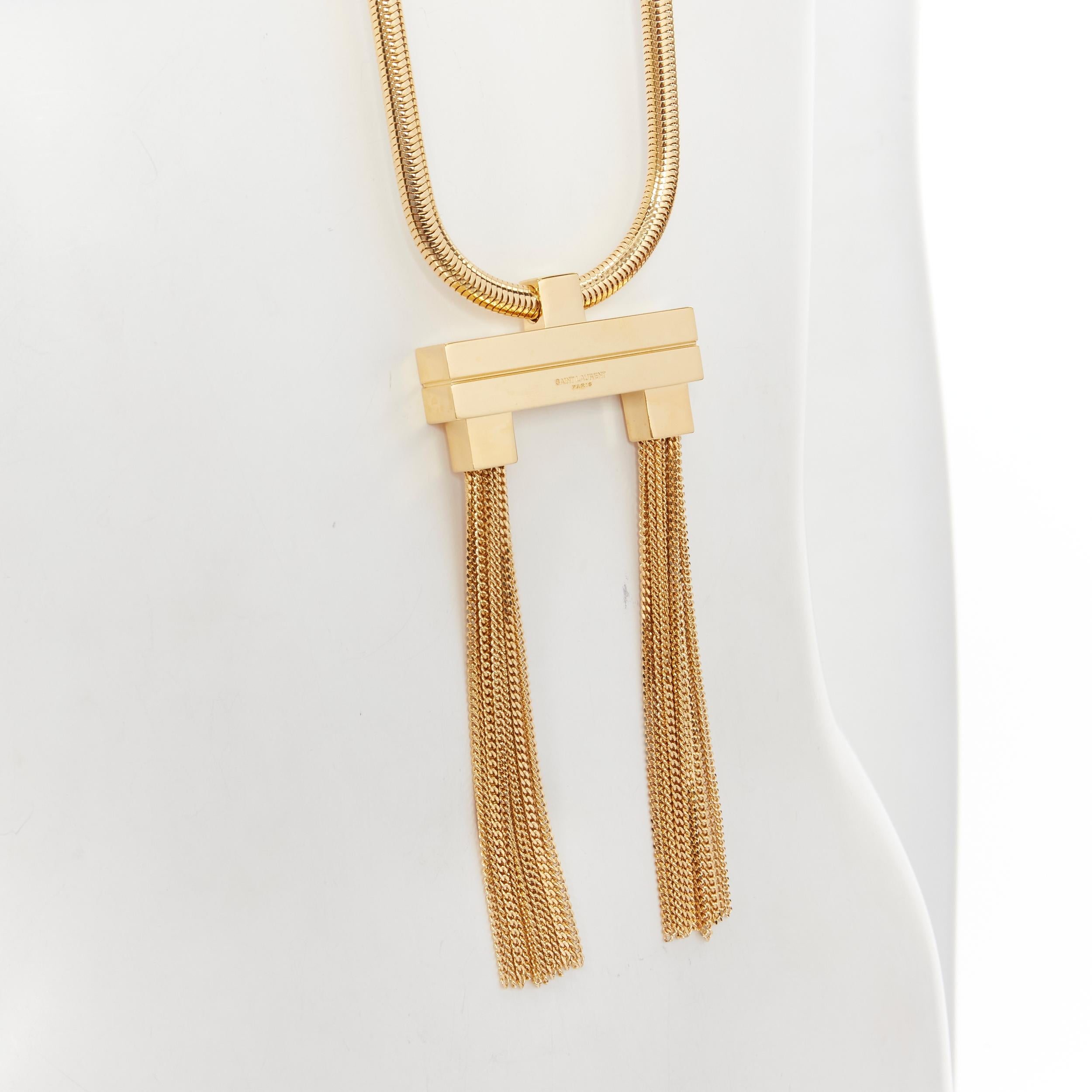 new SAINT LAURENT Hedi Slimane 2013 Runway Opium gold double tassel necklace 
Reference: TGAS/B01710 
Brand: Saint Laurent 
Designer: Hedi Slimane 
Collection: 2013 Runway 
Material: Metal 
Color: Gold 
Pattern: Solid 
Closure: Clasp 
Extra Detail: