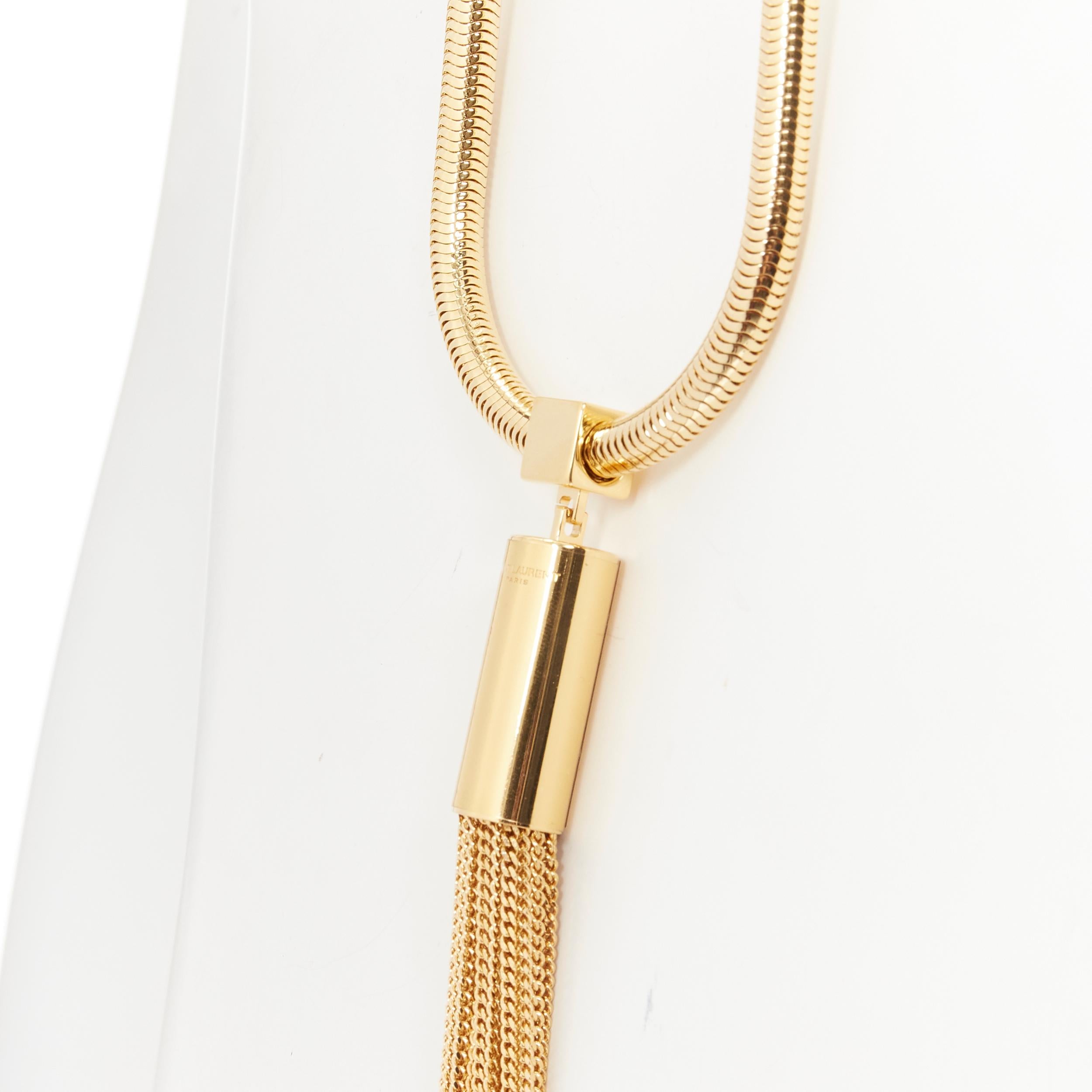 new SAINT LAURENT Hedi Slimane 2013 Runway Opium gold tassel coil necklace 
Reference: TGAS/B01805 
Brand: Saint Laurent 
Designer: Hedi Slimane 
Collection: 2013 Runway 
As seen on: Rihanna 
Material: Metal 
Color: Gold 
Pattern: Solid 
Closure:
