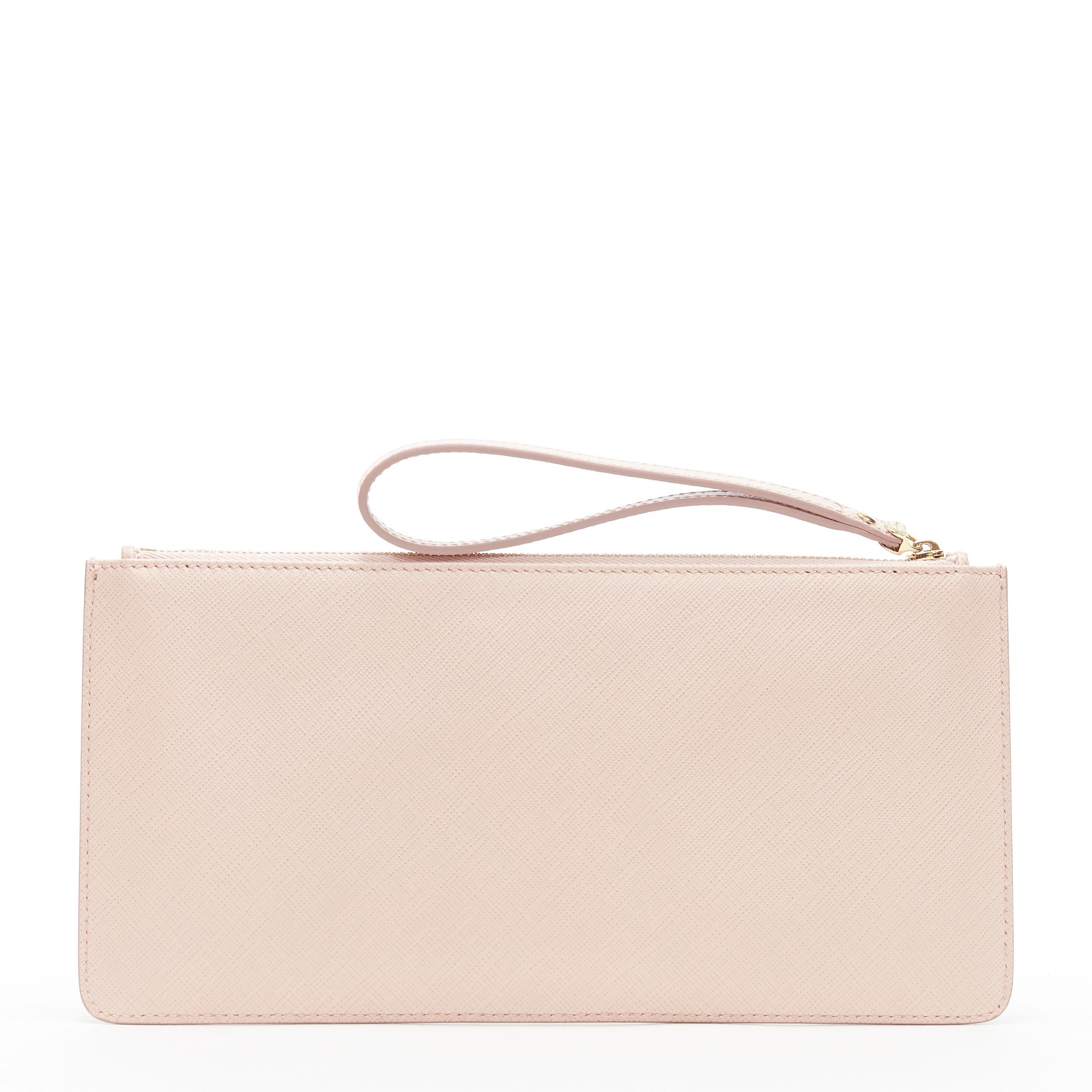 new SALVATORE FERRAGAMO blush pink gold logo top zip wristlet pouch clutch bag
Brand: Salvatore Ferragamo
Model Name / Style: Zip pouch
Material: Leather
Color: Pink
Pattern: Solid
Closure: Zip
Extra Detail:
Made in: Italy

CONDITION: 
Condition: