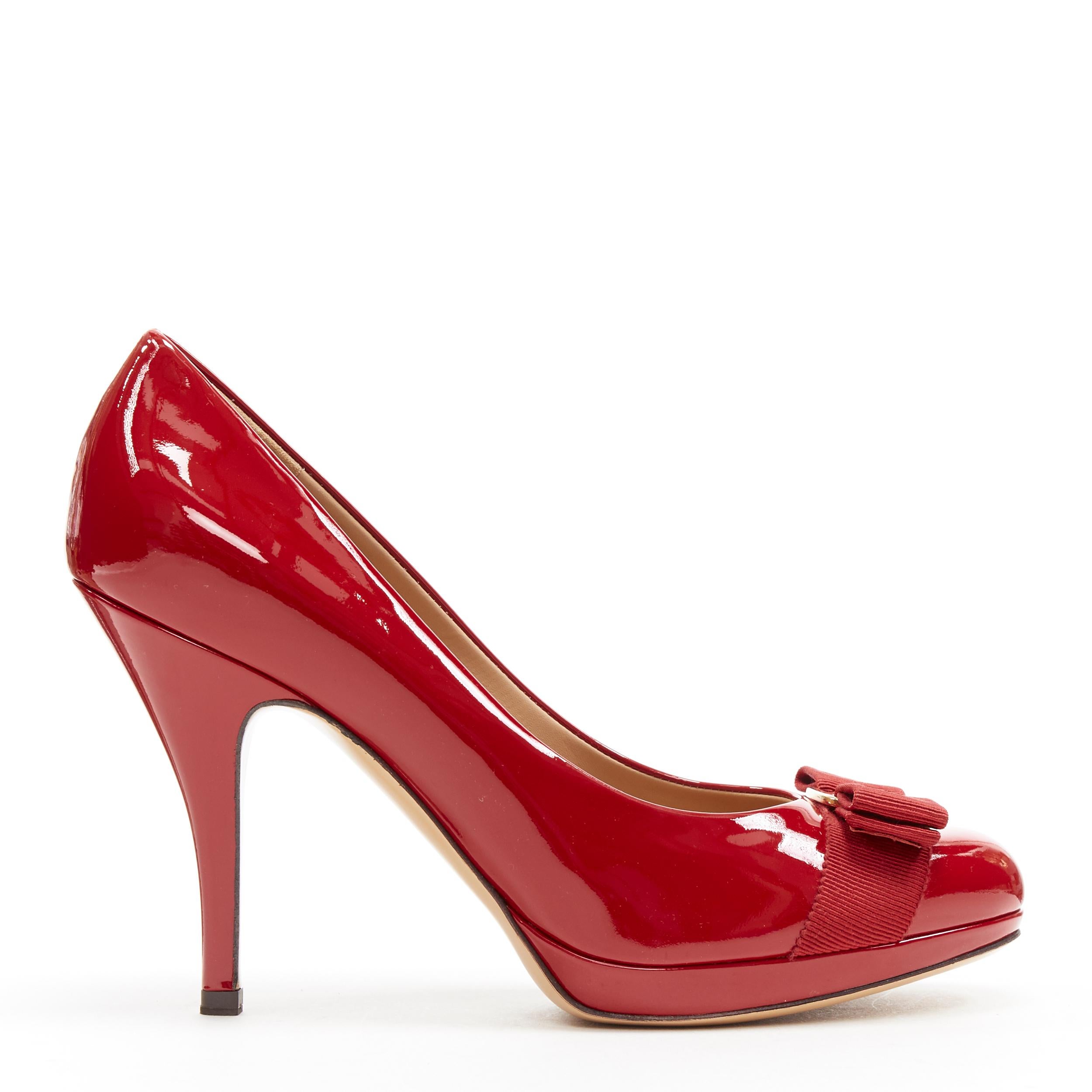 new SALVATORE FERRAGAMO Tina 90 red patent bow platform pump US7.5 EU37.5 Reference: CC/JEYN00376 
Brand: Salvatore Ferragamo 
Model: Tina 90 
Material: Patent leather 
Color: Red 
Pattern: Solid 
Extra Detail: Style name: Tina. Rosso patent calf.