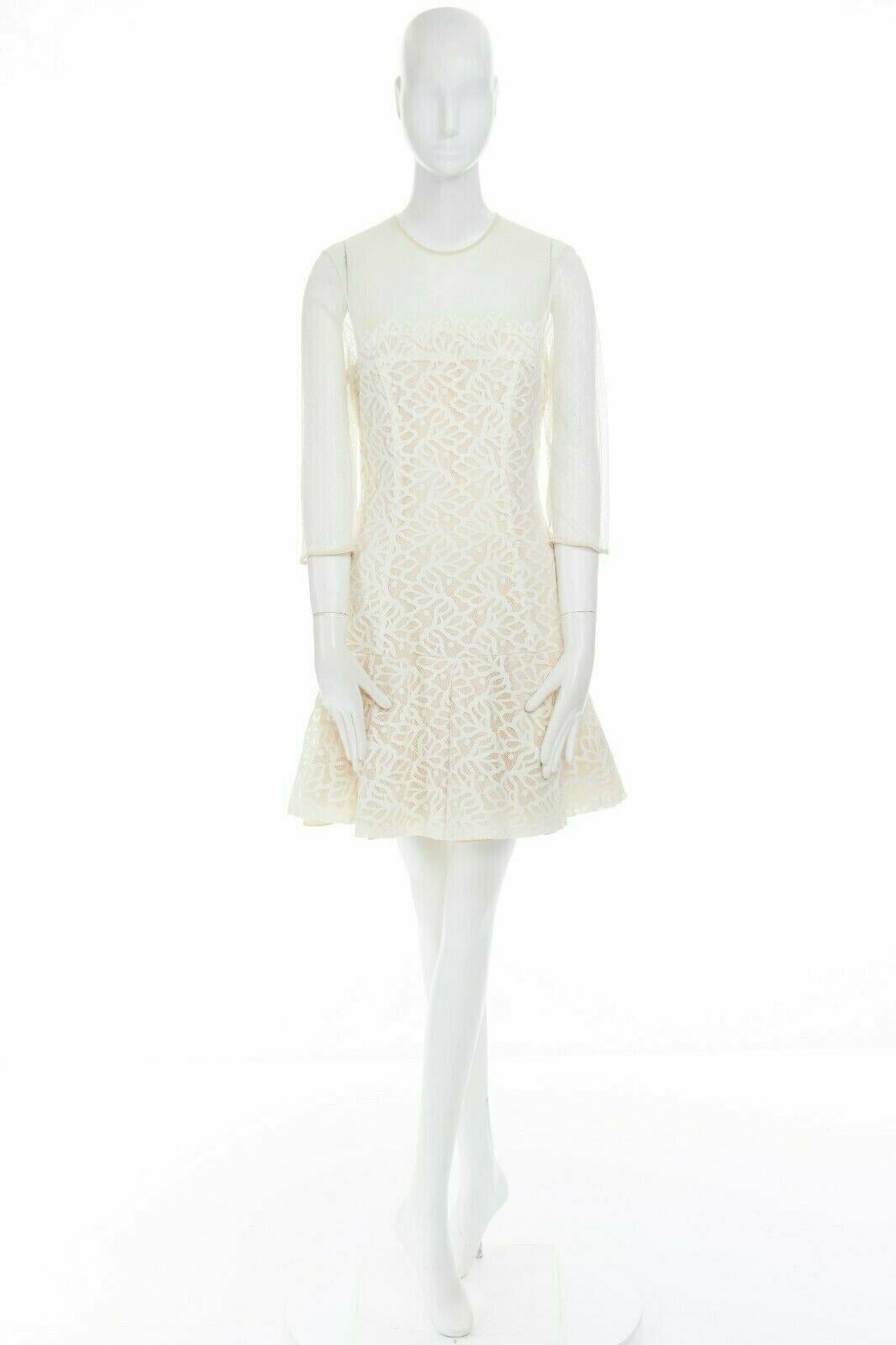 new SANDRO cream white mesh swiss dot guipure floral lace flared dress L FR40 
Reference: WEYN/A00194 
Brand: Sandro 
Material: Polyamide 
Color: Cream 
Pattern: Floral 
Closure: Zip 
Extra Detail: Ecru polyamide, polyester, silk, nylon, elastane.