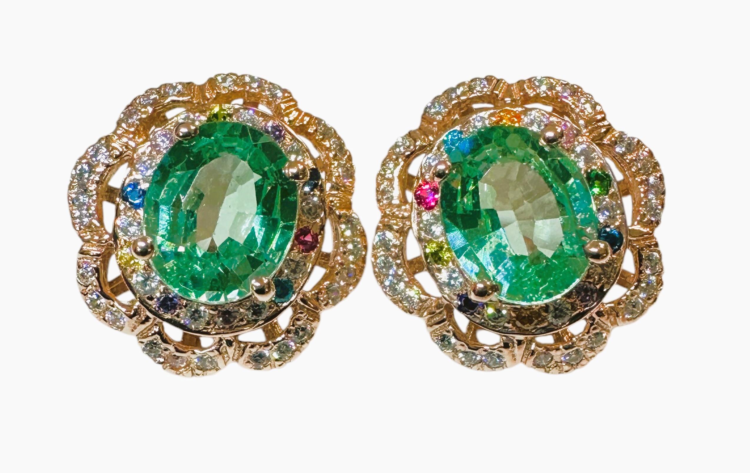 These earrings are just gorgeous!  The photos just don't do them justice.  The stones are from Brazil and are 4.25 cts each. They measure 10.2 x 8.3 mm.  These beautiful stones are surrounded by diamond cut Sapphire stones of various colors which