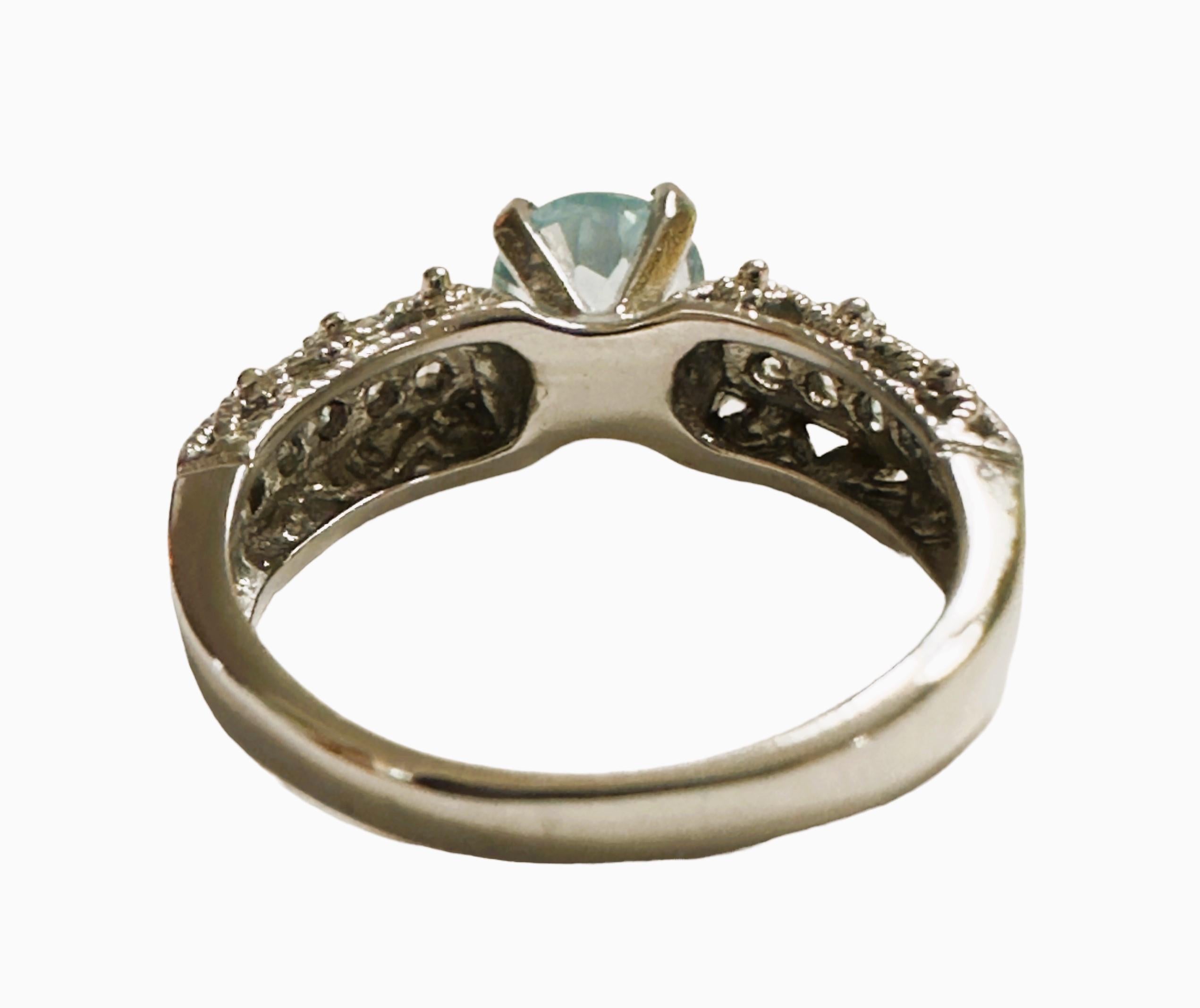 What a beautiful ring!  The ring is a size 5.5. This stone is from the Philippines. It is a beautiful round cut stone and is 1.10 cts.  It's a very high quality stone.  The 