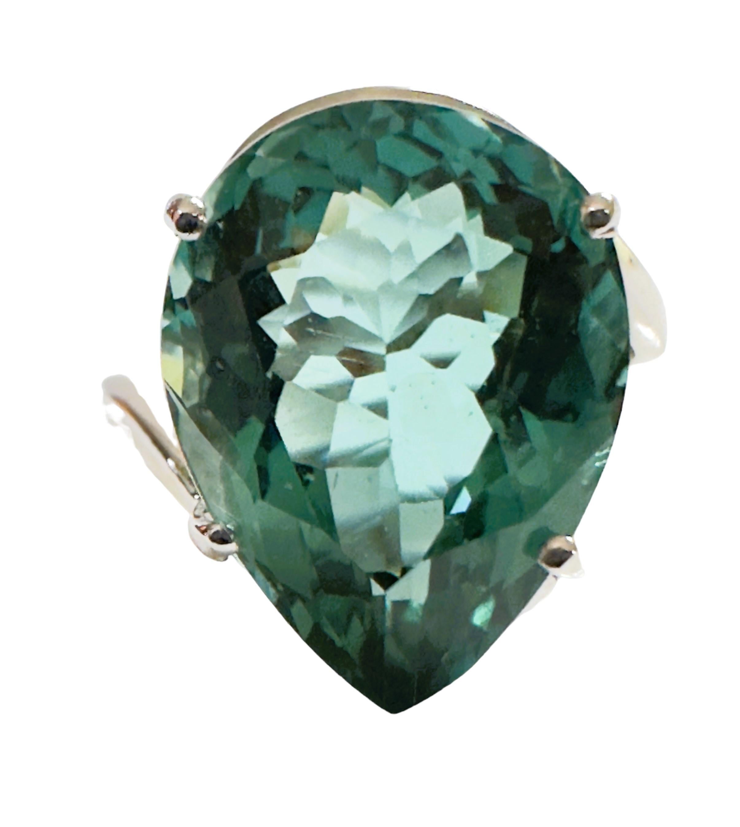 What a beautiful ring!  The ring is a size 6.25. This stone is from the Philippines. It is a beautiful pear cut stone and is 8.7 cts.  It's a very high quality stone.  The 