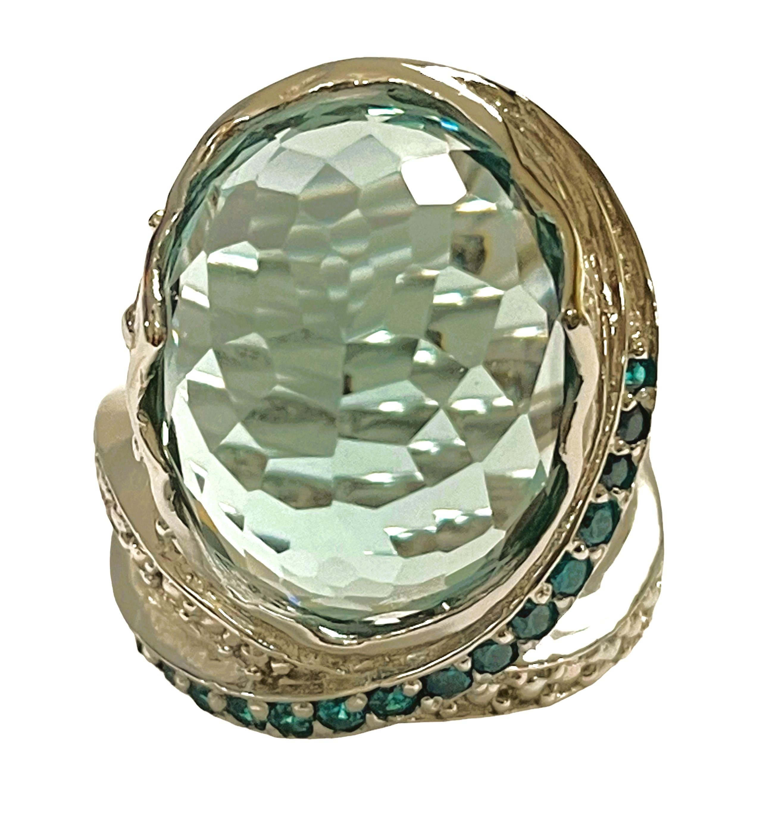 What a fabulous ring!  Just a unique design!  The ring is a size 6.5.  This beautiful aquamarine stone was mined in the Philippines. It is a beautifully cut oval dome stone and is 18.10 cts.  It's a very high quality stone.  The 