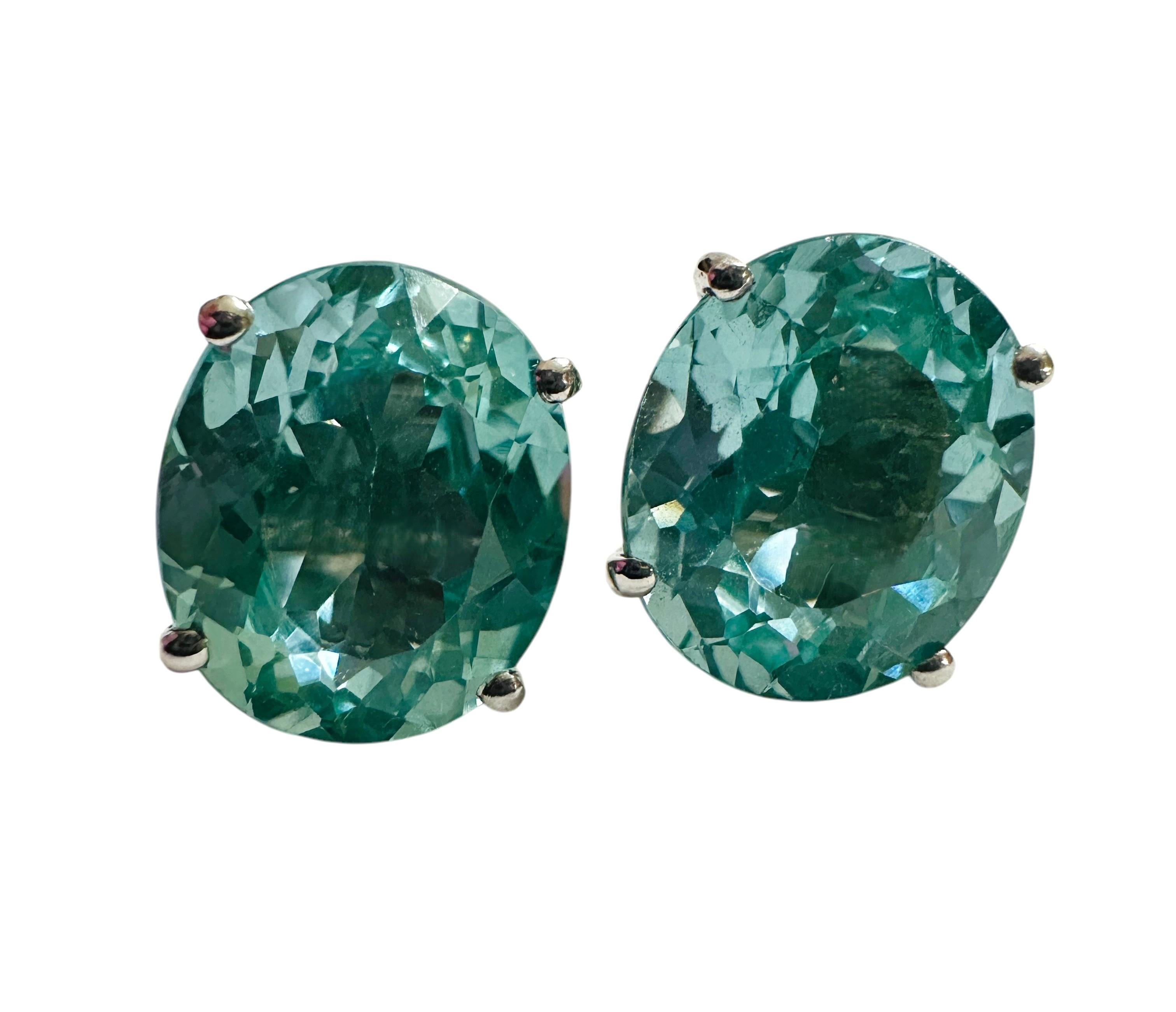 These earrings are just a spectacular color. The stones are from Brazil and are just exquisite.  They are oval cut stones and are each 6.15 Cts.   They measure 12.2 mm long and 10.2 mm wide.  They  have a butterfly back that is stamped 