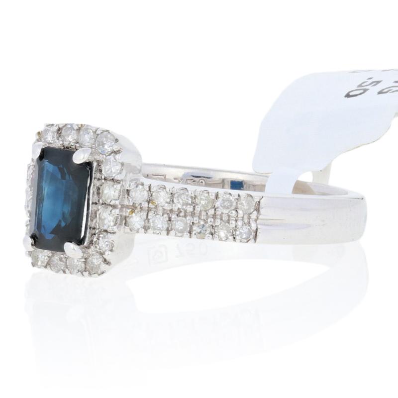 Timelessly sophisticated and refined, this stunning NEW gemstone ring is destined to become a favorite addition to your fine jewelry collection! Composed of glistening 18k white gold, this piece showcases a sumptuous blue sapphire solitaire framed