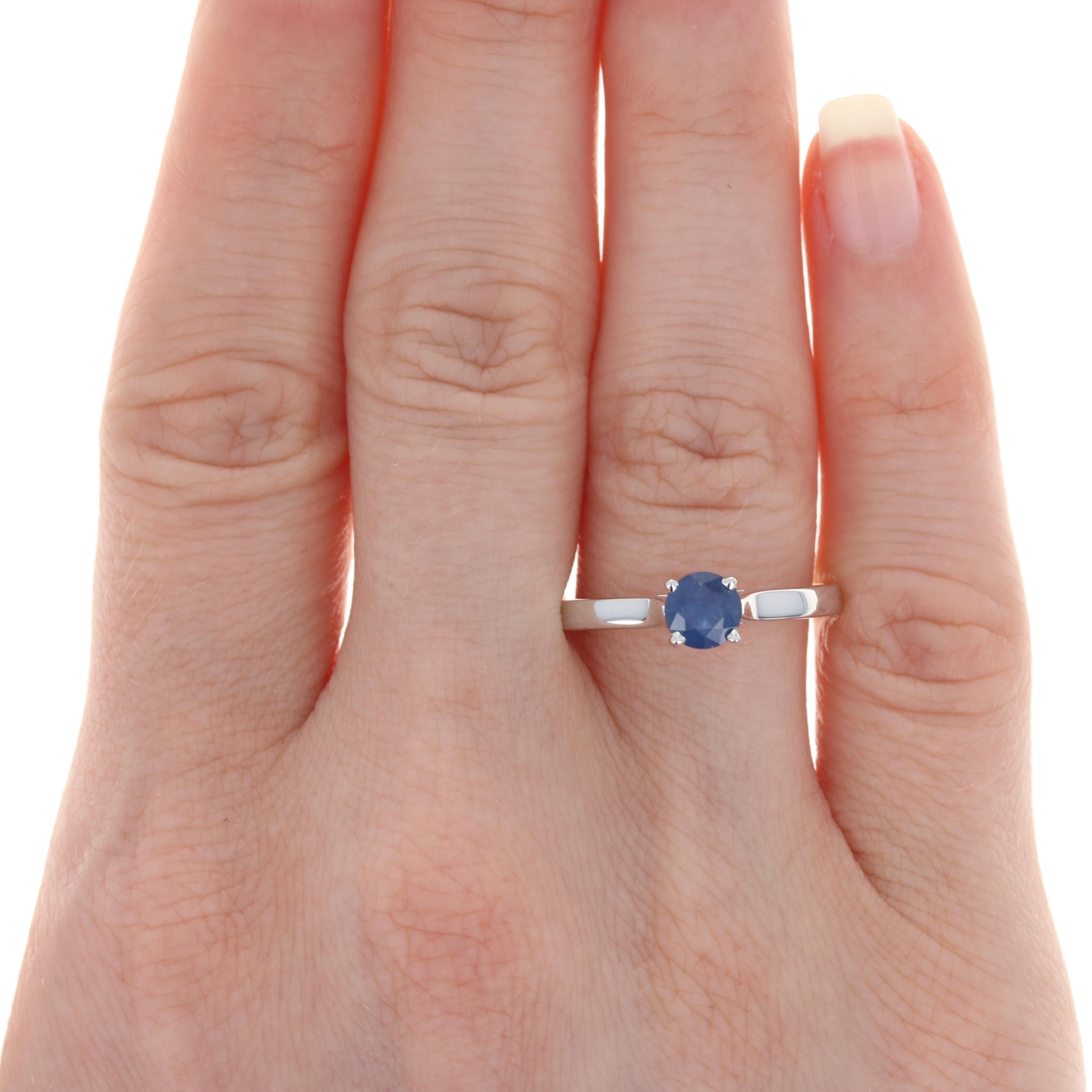 Dazzle and delight your sweetheart when you propose to her with this gorgeous NEW engagement ring! Featuring a cathedral-style mount, this 14k white gold piece showcases a heavenly blue sapphire solitaire that is held by four prongs which allow