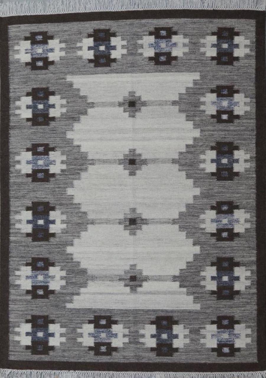 Beautiful new Kilim with geometrical Scandinavian design and light colors, entirely handwoven with wool on cotton foundation.