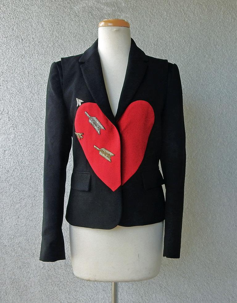 ****Price has been lowered to from $7500 to $5500

Beautiful Schiaparelli black wool blazer with signature large red heart pierced by embroidered gold arrows, with a small spray of clear stones.  Four (4) small delicate buttons showcasing Signature