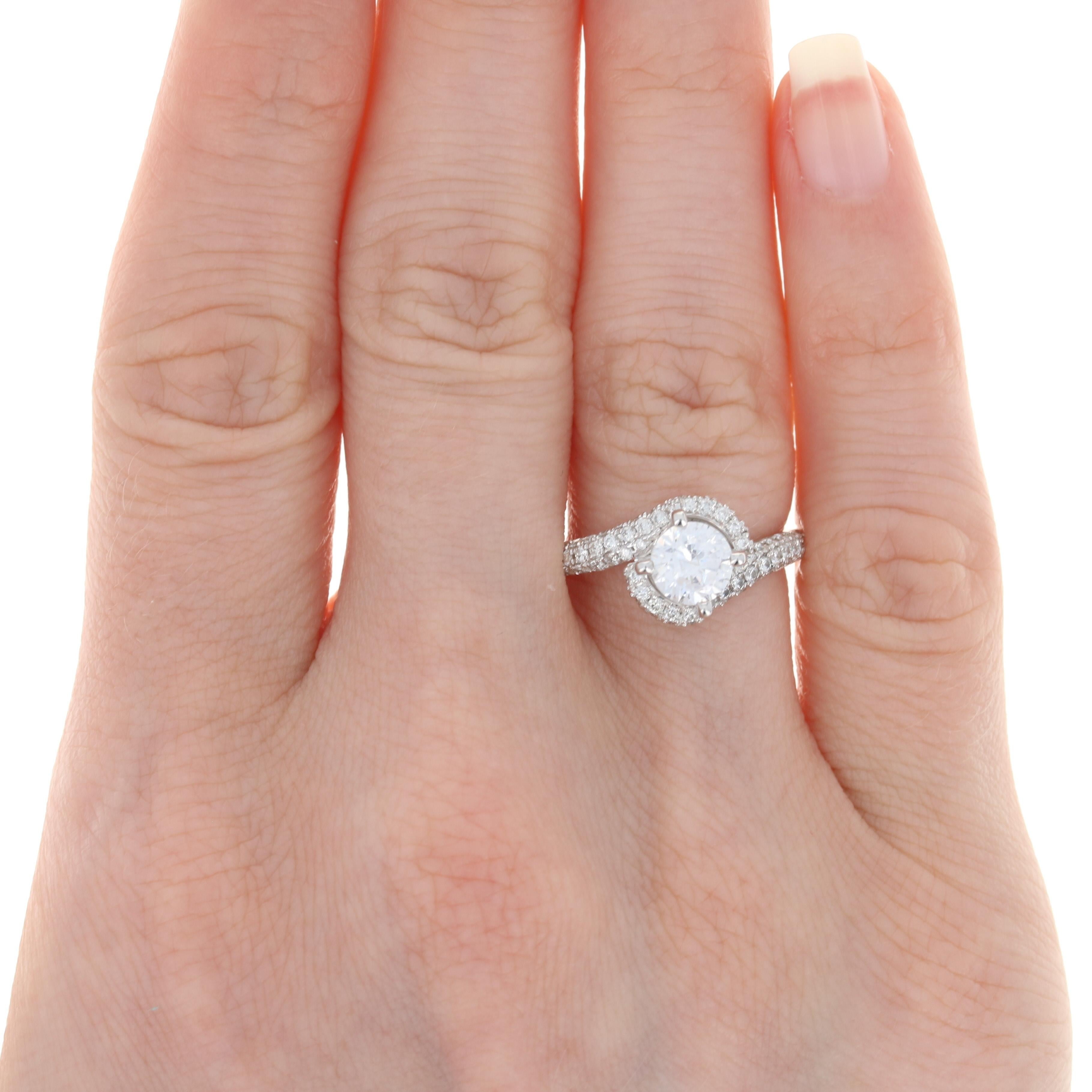 Showcase your perfect diamond solitaire or heirloom gemstone in this beautiful semi-mount engagement ring! Designed by Scott Kay in popular 14k white gold, this NEW bypass-style ring features a raised mounting that will accommodate a stone measuring