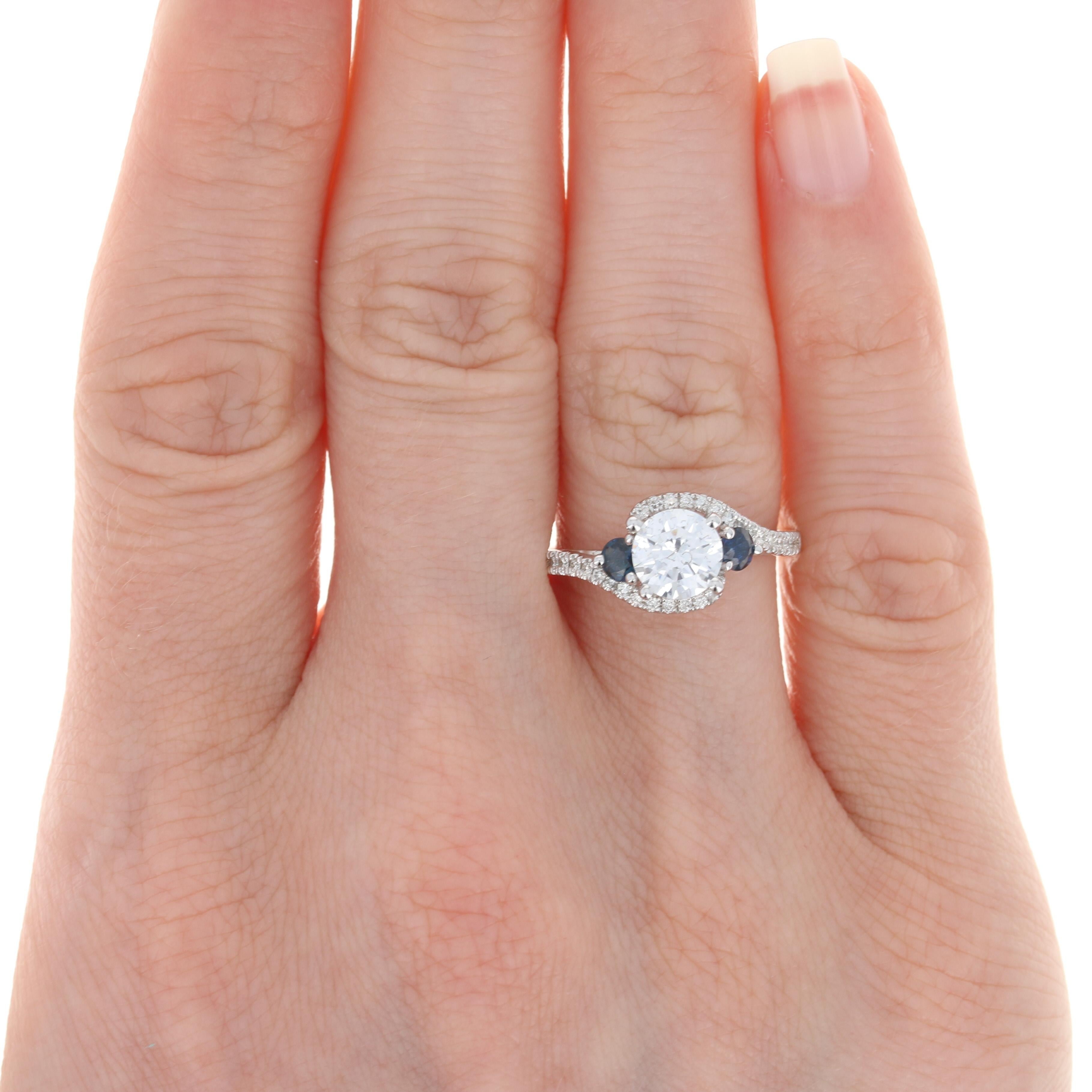 Showcase your perfect diamond or heirloom gemstone in this NEW three-piece wedding set by Scott Kay. Fashioned in popular 14k white gold, the set features an elegant, bypass-style engagement ring with a raised semi-mount for a 6.5mm diamond or