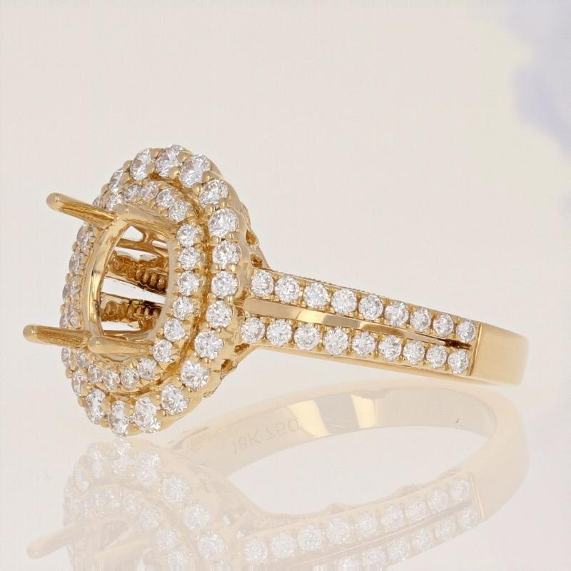 This exquisite semi-mount ring will be the perfect piece to host a treasured solitaire! Featuring a radiant double halo design, this 18k yellow gold ring showcases a sparkling collection of white diamond accents that adorn the ring’s haloes and
