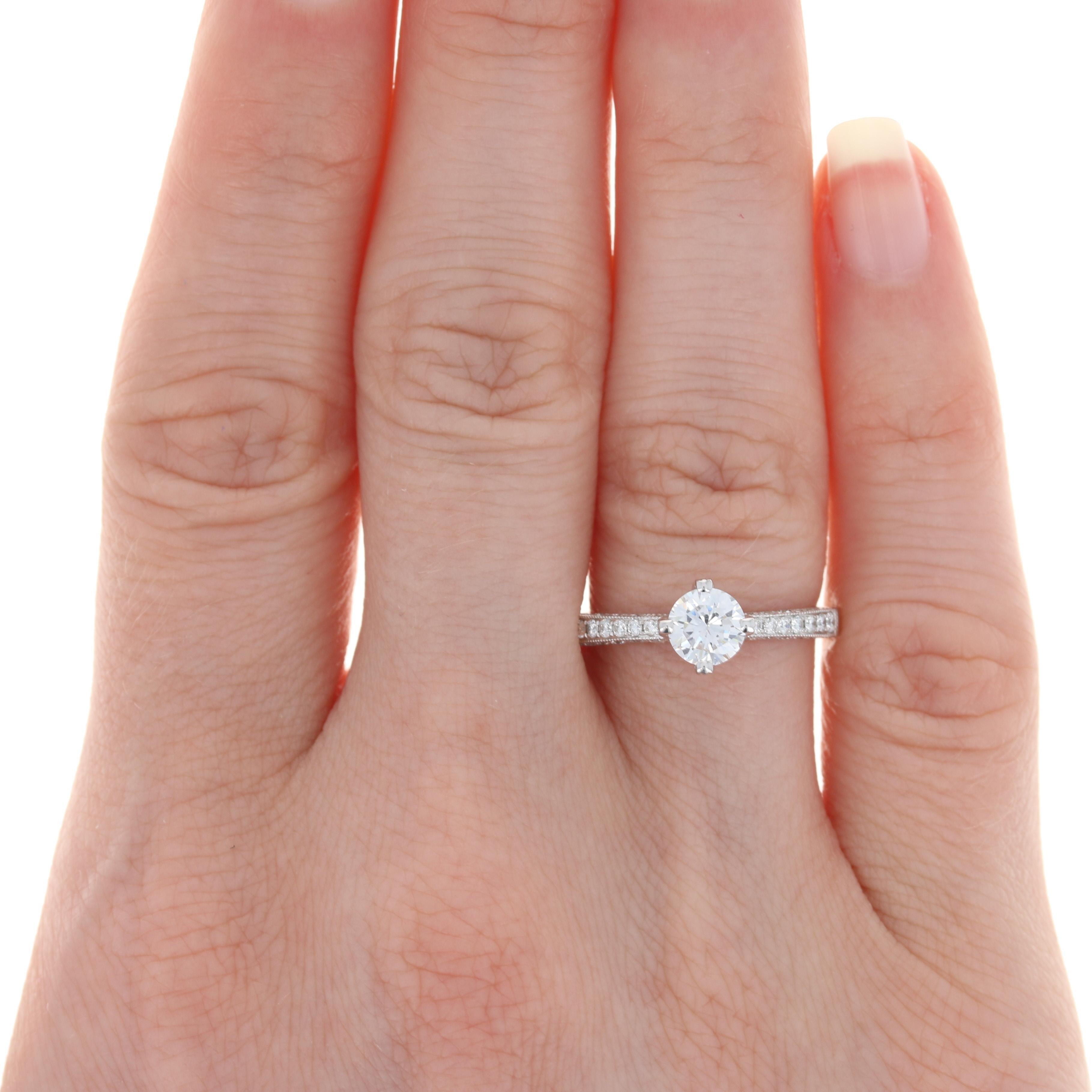 Your bride-to-be is sure to absolutely adore this gorgeous NEW semi-mount engagement ring! Crafted in glistening 14k white gold, this piece showcases a dazzling array of icy white diamond accents outlined by milgrain detailing that will elegantly
