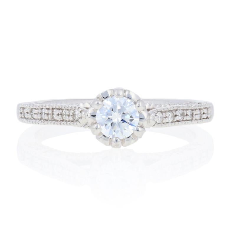 Give your beautiful diamond new life in an updated setting! Designed in popular 14k white gold, this NEW engagement ring features a semi-mount for a diamond or gemstone measuring 4.3 - 5mm across the center. A coronet of beaded prongs currently