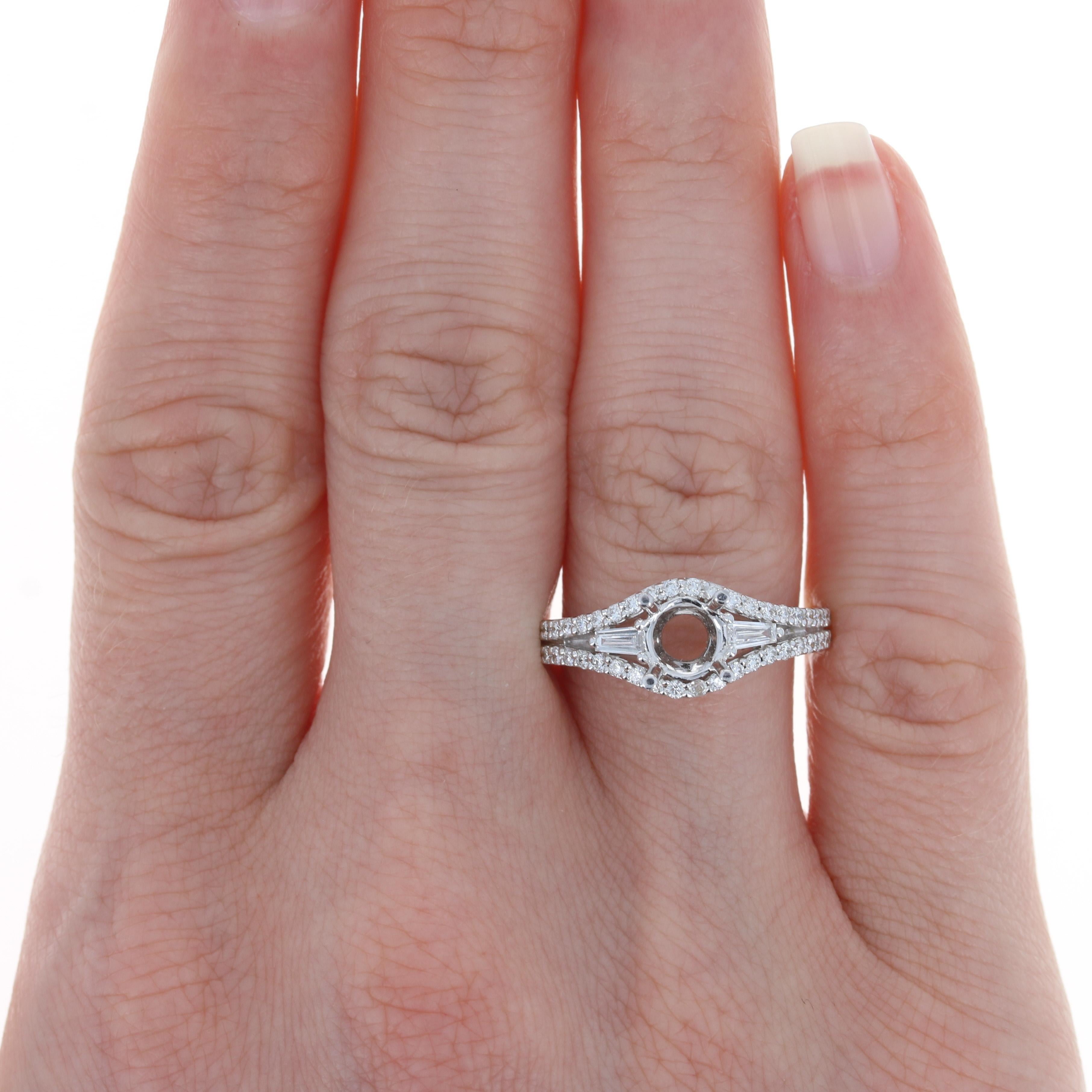 Your search for the perfect setting for your diamond solitaire or heirloom gemstone ends here with this elegant semi-mount ring! Fashioned in high purity 18k white gold, this NEW piece features a four-pronged mounting that will accommodate a stone