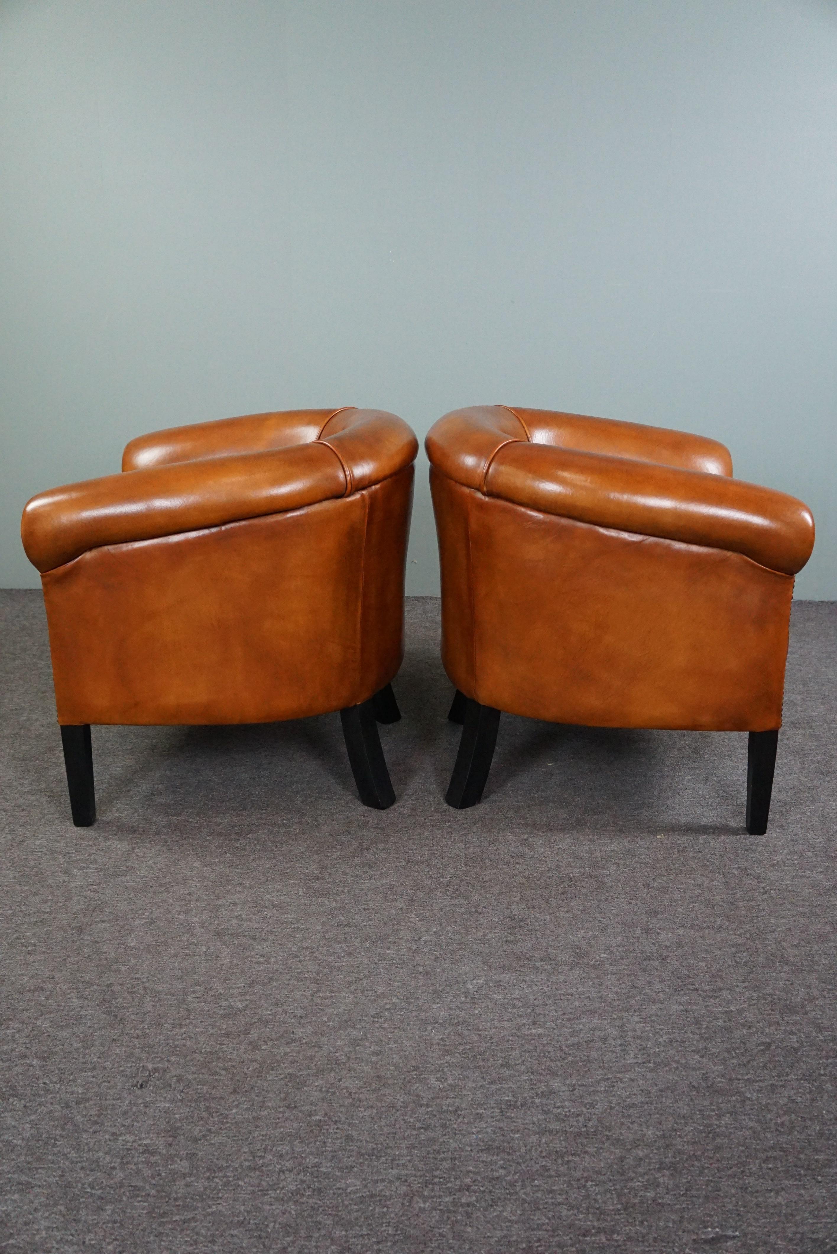 Hand-Crafted New set of 2 subtle sheep leather club chairs For Sale