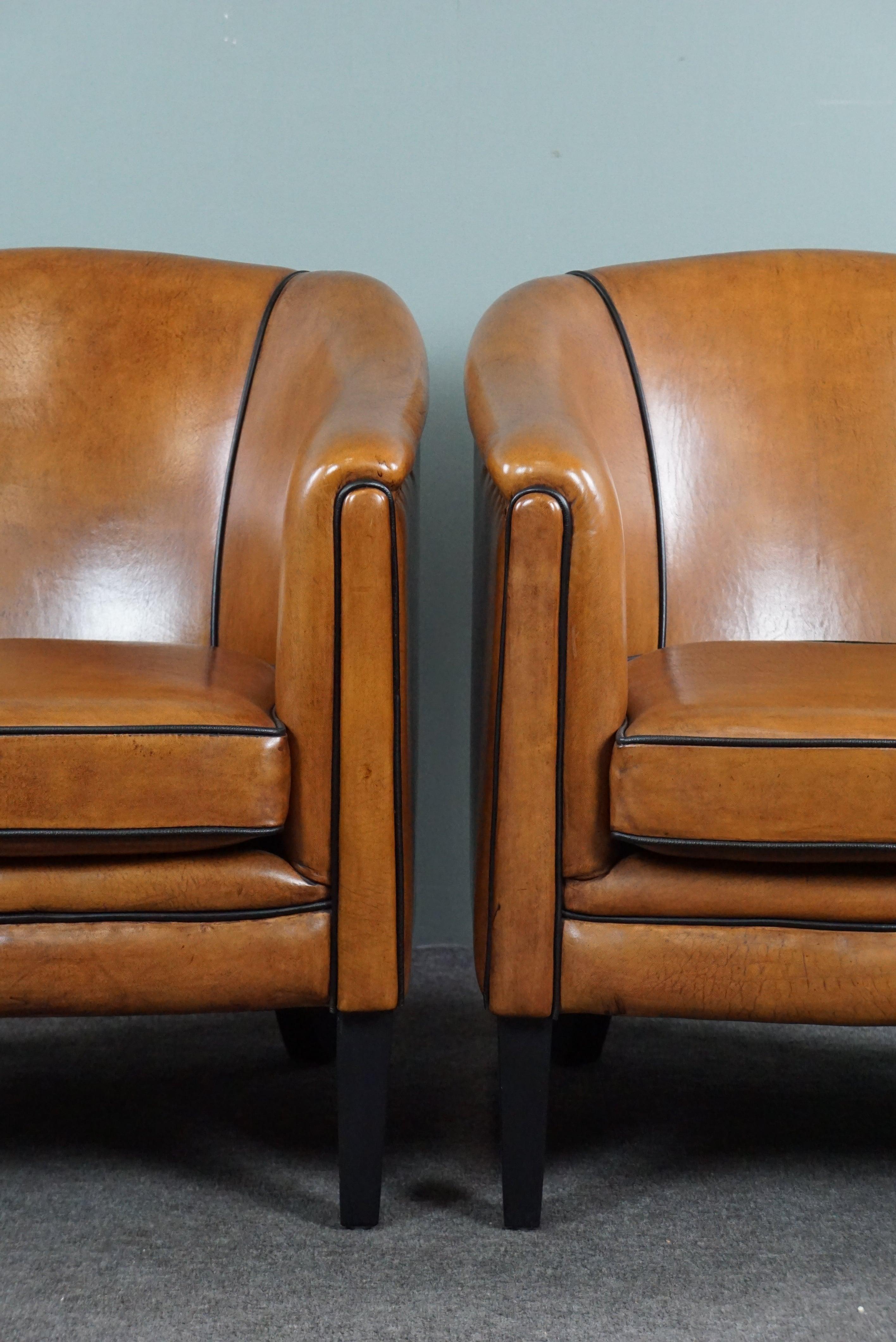 Offered is this beautiful new set of two sheep leather club chairs made exclusively from top materials.

Where to start to say something about this new set of two sheepskin armchairs.
Are they the warm colors of the hand-patinated sheep leather or