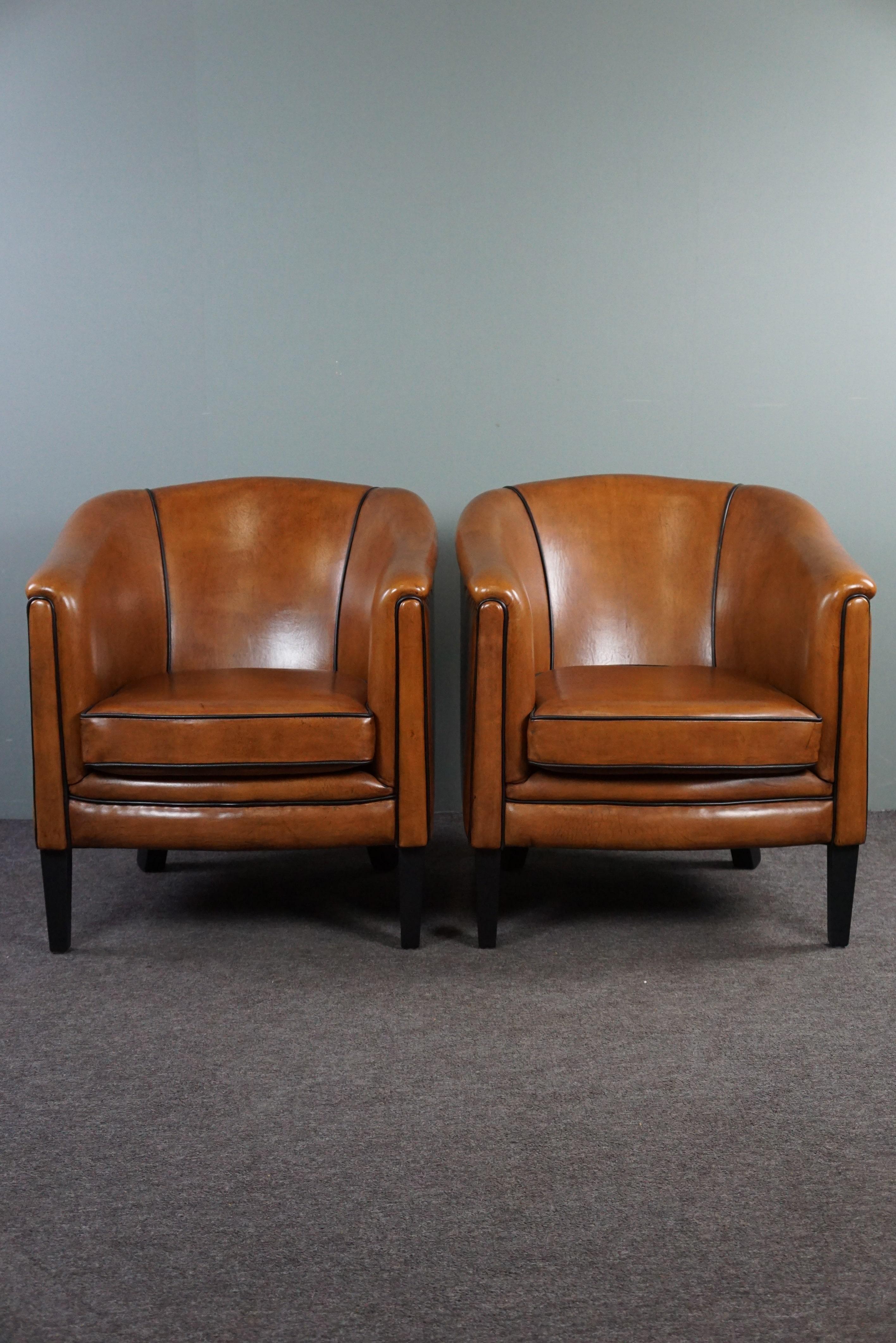 Dutch New set of two sheep leather armchairs with black piping For Sale