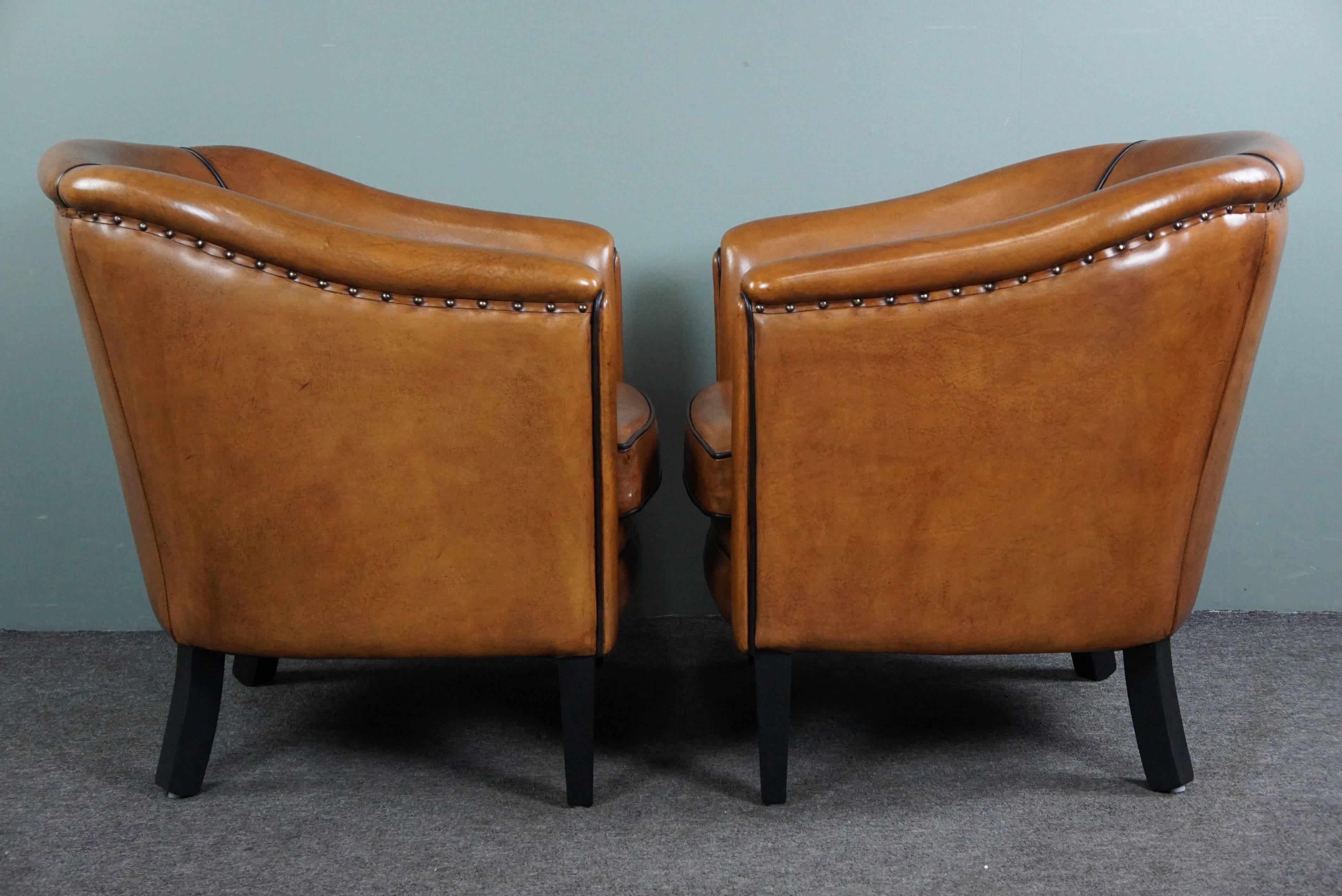 Hand-Crafted New set of two sheep leather armchairs with black piping For Sale