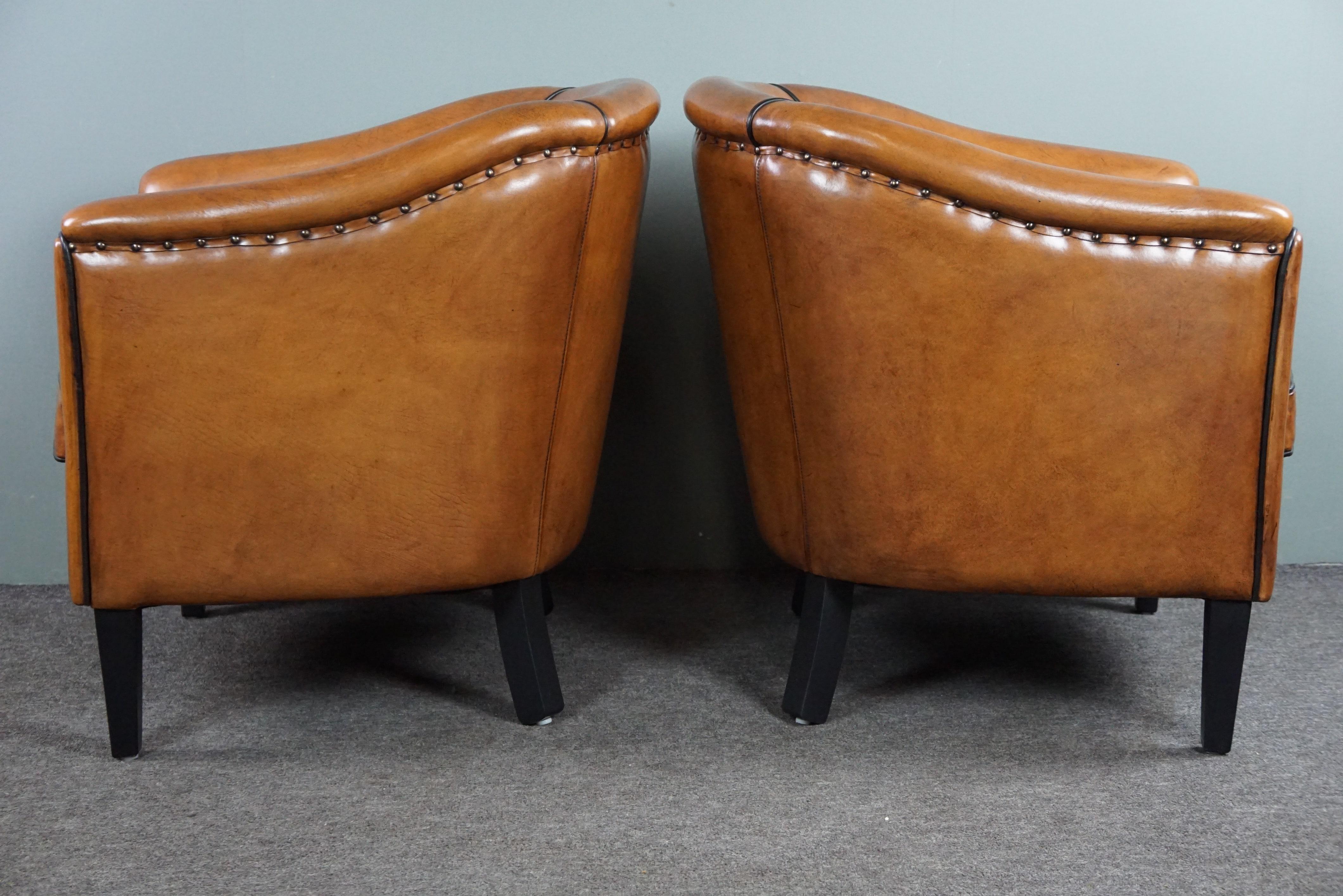 Contemporary New set of two sheep leather armchairs with black piping For Sale