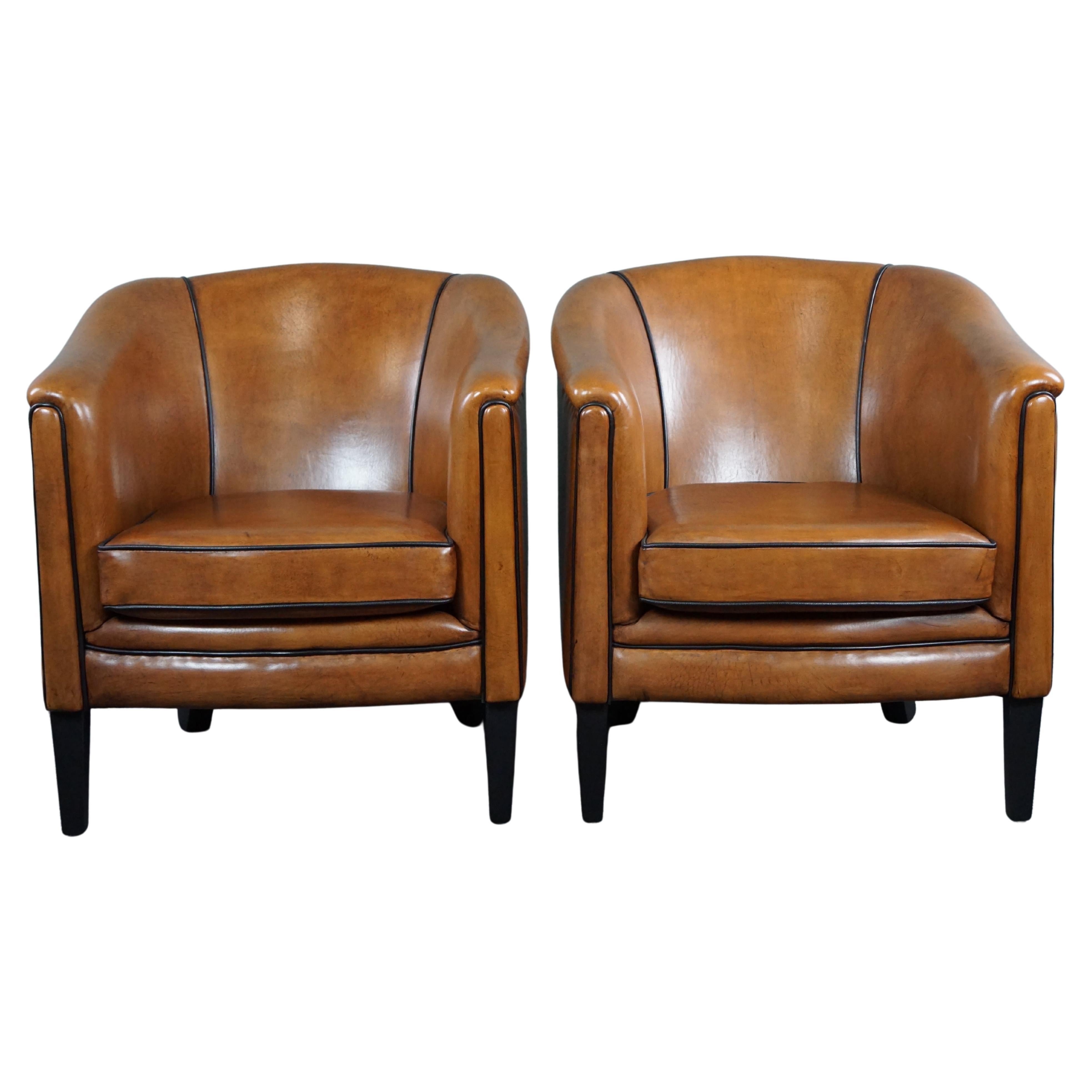 New set of two sheep leather armchairs with black piping For Sale