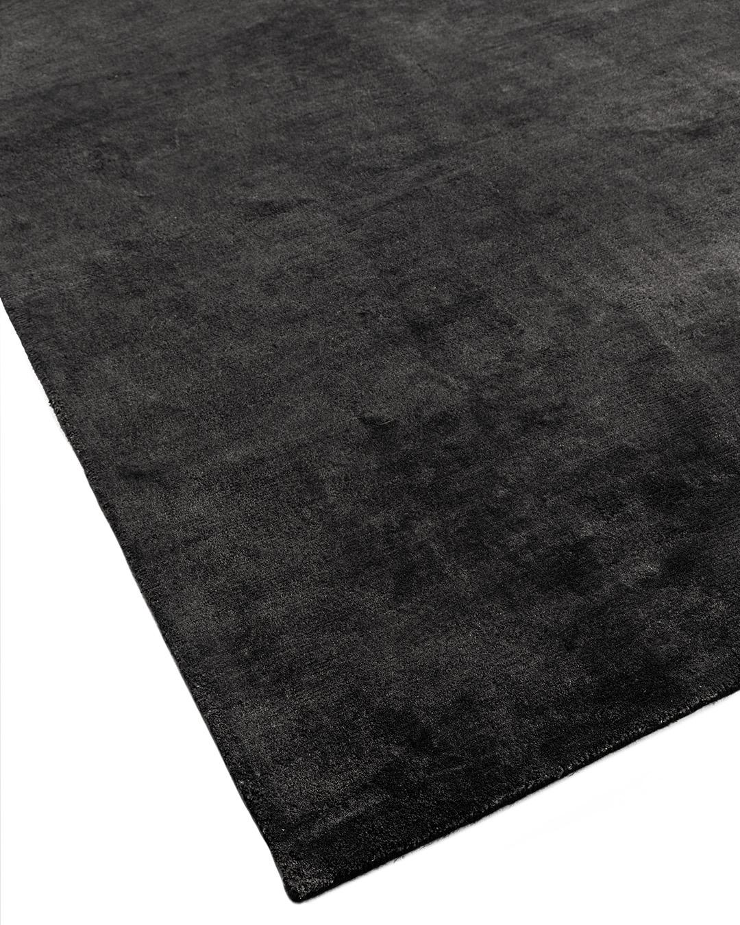 New Solid Charcoal Hand Knotted rug, measure 12' x 15'. A luxurious, lavish, simple lustrous, hand knotted linen rug, that will give an overall feel of calm good design.