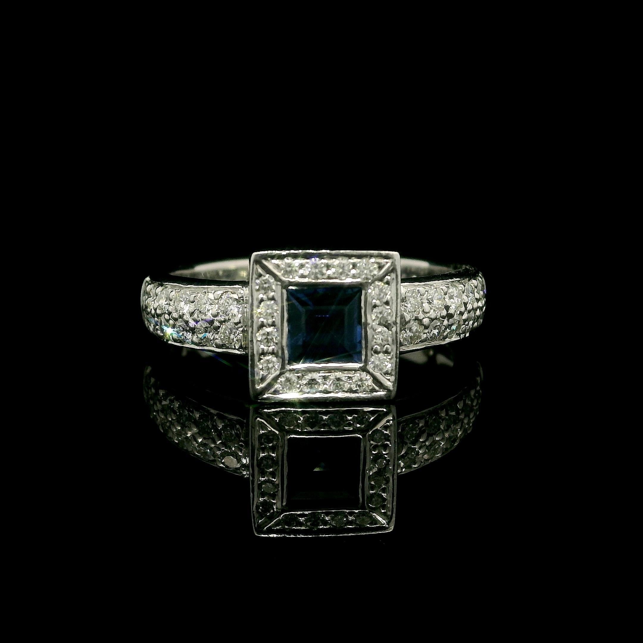 --Stone(s):--
(1) Natural Genuine Sapphire - Square Step Cut - Bezel Set - Rich Blue Color - 0.40ct (approx.)
(50) Natural Genuine Diamonds - Round Brilliant Cut - Pavé Set - VS1/VS2 Clarity - F/G Color - 0.40ctw (approx.)
Total Carat Weight: 0.80