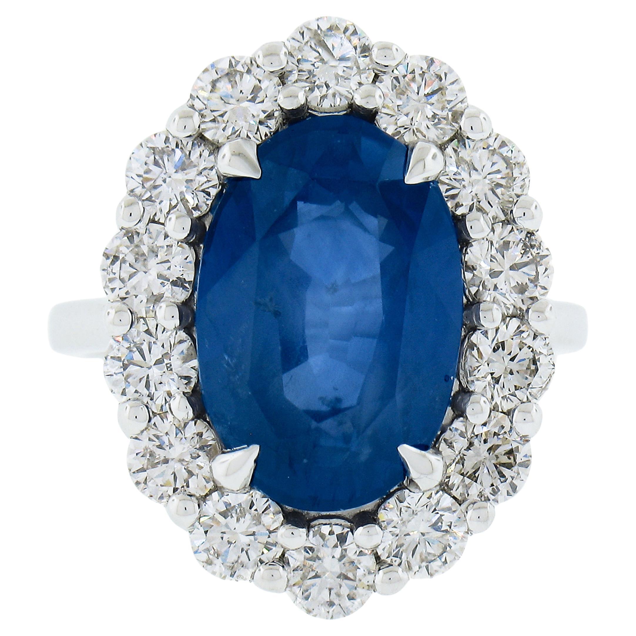 New Solid Platinum 10.24ctw GIA Oval Blue Sapphire & Round Diamond Halo Ring For Sale