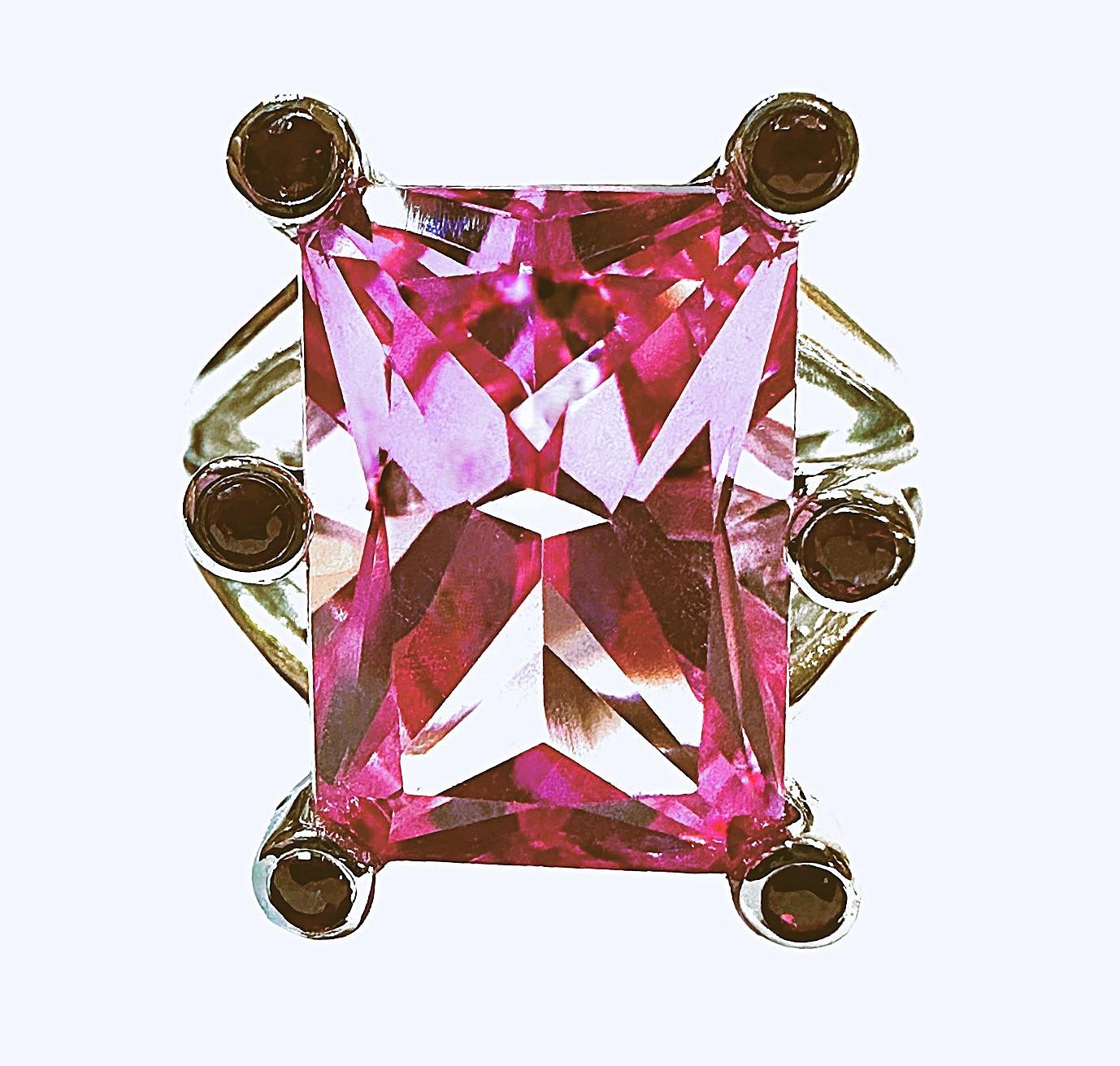 I just love the color of this stone.   And the cut of the stone is just phenomenal!  The ring is a size 6.5.  It is from Sri Lanka and is just exquisite.   It's a very high quality stone.  It is a fancy Asscher Cut stone and is 11.0 Cts.   The main