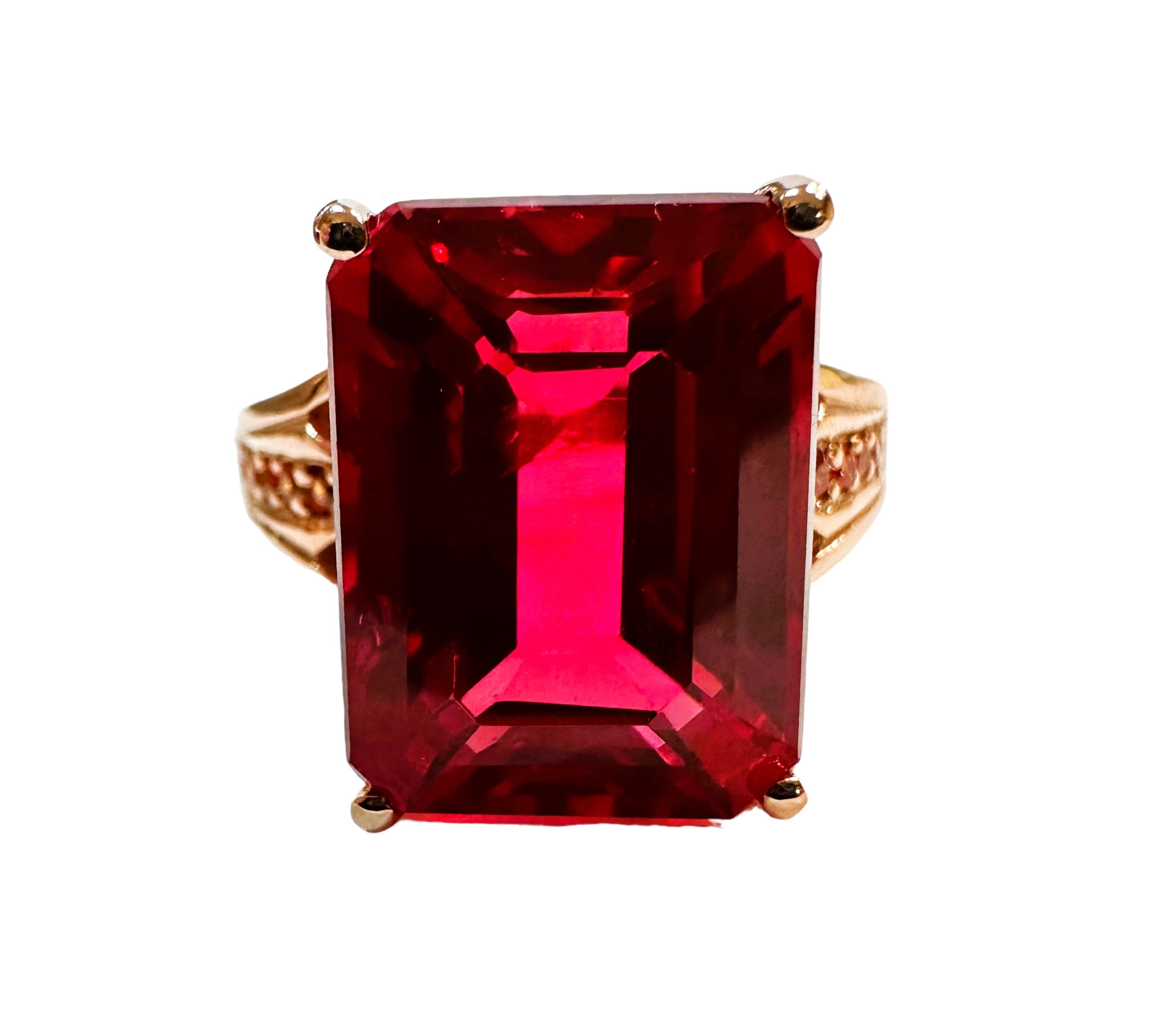 I just love the beautiful colors this ring has!  What a great color combination. The ring is a size 7.   It is from Sri Lanka and is just exquisite.   It's a very high quality stone.  It is an emerald cut stone and is 13.0 Cts.   The main stone is