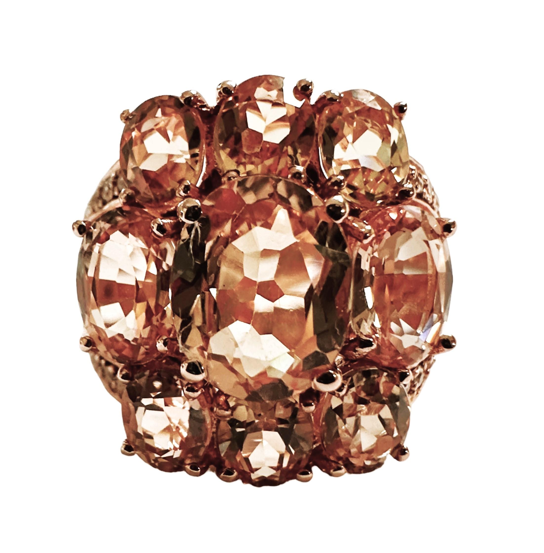 The color of this stone and design of this ring is just phenomenal. The ring is a size 6.5.   It is a 9-stone ring and the stones are from Sri Lanka and are just exquisite. They are very high quality stones.  They are oval cut stones and total 8.30