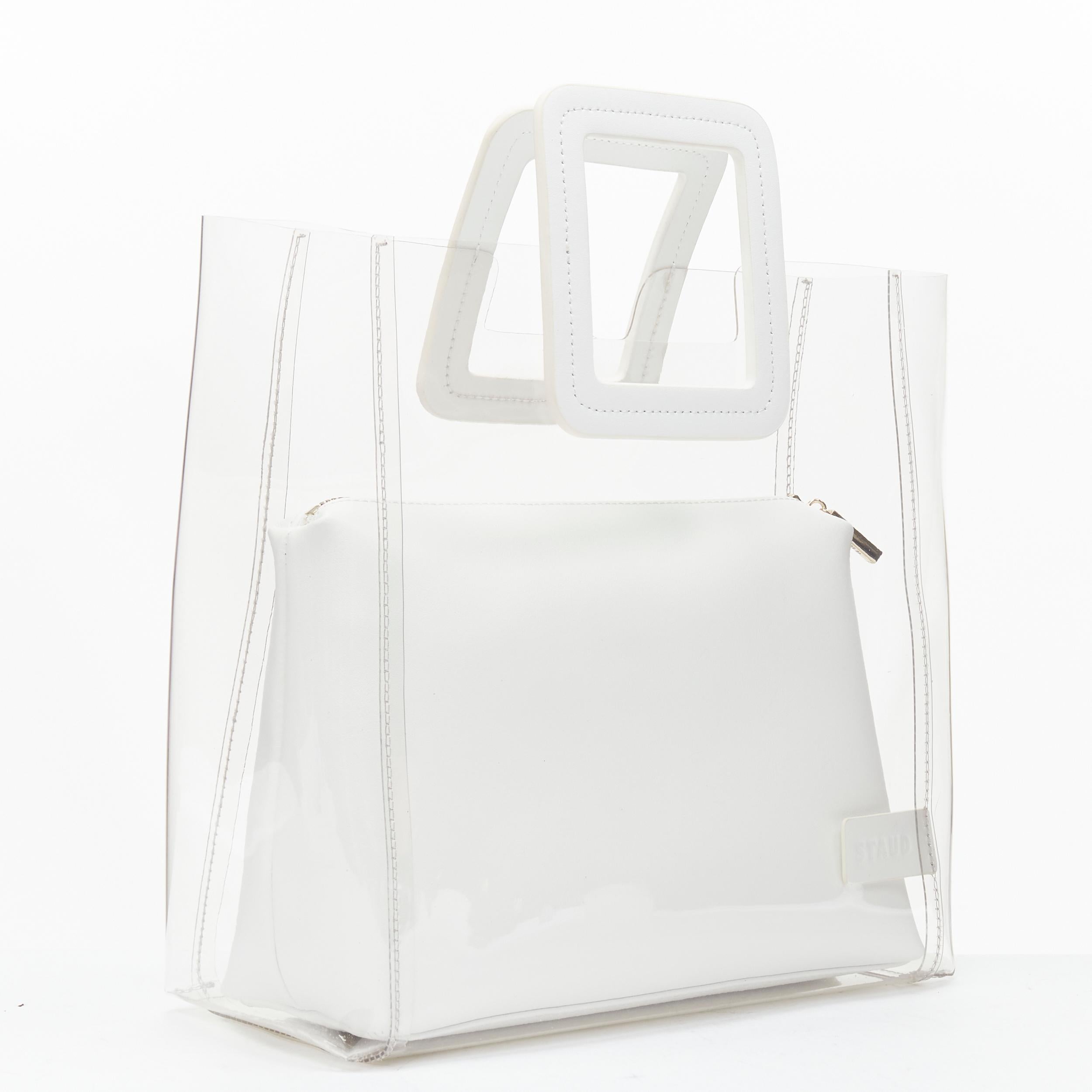 new STAUD Shirley clear PVC white leather square handle pouch clutch tote bag 
Reference: TACW/A00027 
Brand: Staud 
Model: Shirley 
Material: PVC 
Color: White
Pattern: Solid 
Extra Detail: Leather zip pouch 2-in-1 clear PVC tote bag. 
Estimated