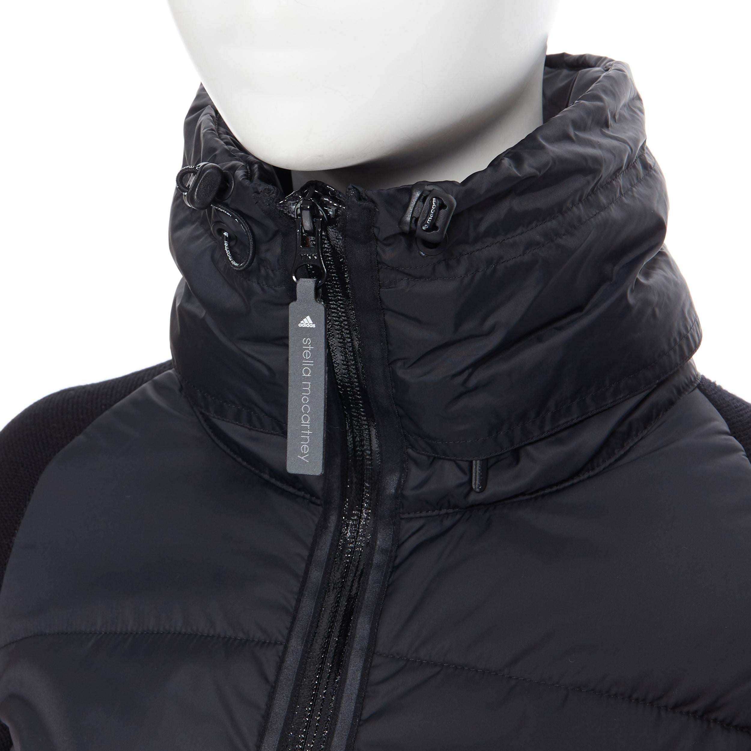 new STELLA MCCARTNEY ADIDAS black padded nylon sock knit fitted sleeve jacket XS
Brand: Adidas
Designer: Stella McCartney
Collection: 2011
Model Name / Style: Padded jacket
Material: Nylon, viscose 
Color: Black
Pattern: Solid
Closure: Zip
Extra